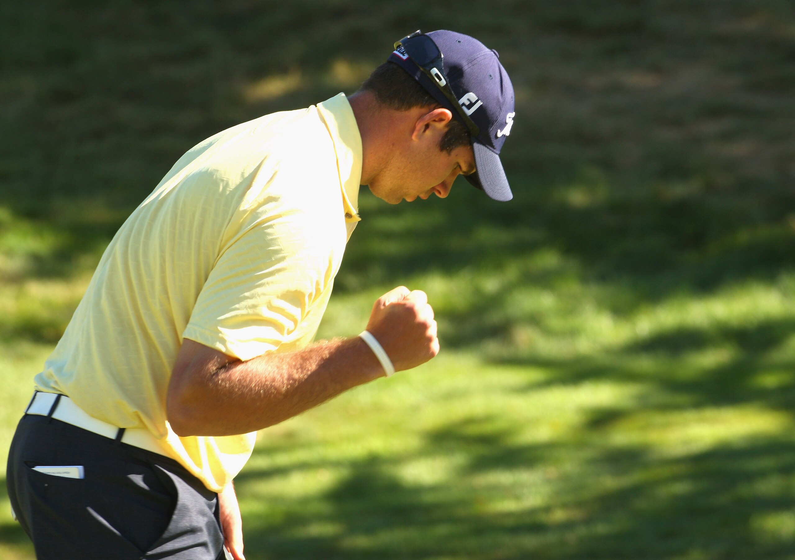 QUEENSTOWN, NEW ZEALAND - JANUARY 31:  Robert Gates of the USA celebrates sinking his putt on the 17th green during day four of the New Zealand Open at The Hills Golf Club on January 31, 2010 in Queenstown, New Zealand.  (Photo by Phil Walter/Getty Images