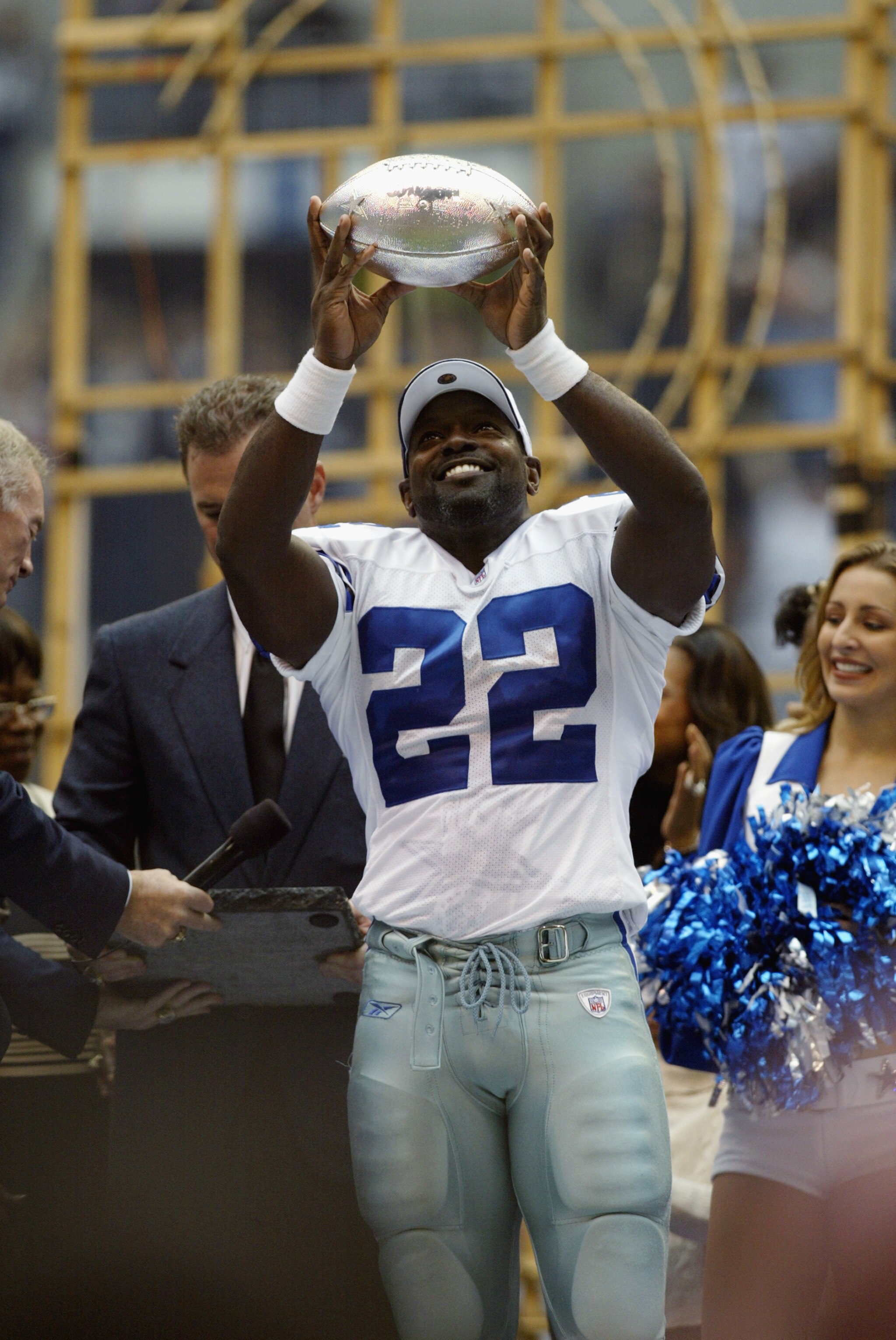 IRVING, TX - OCTOBER 27:    Emmitt Smith #22 of the Dallas Cowboys holds up a silver football emblematic of his breaking the NFL all time rushing record after their game versus the Seattle Seahawks on October 27, 2002 at Texas Stadium in Irving, Texas. Th