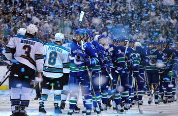 VANCOUVER, CANADA - MAY 24:  Captain Henrik Sedin #33 of the Vancouver Canucks leads his team for the post game handshake with the San Jose Sharks after winning Game Five of the Western Conference Finals 3-2 in the second overtime during the 2011 Stanley