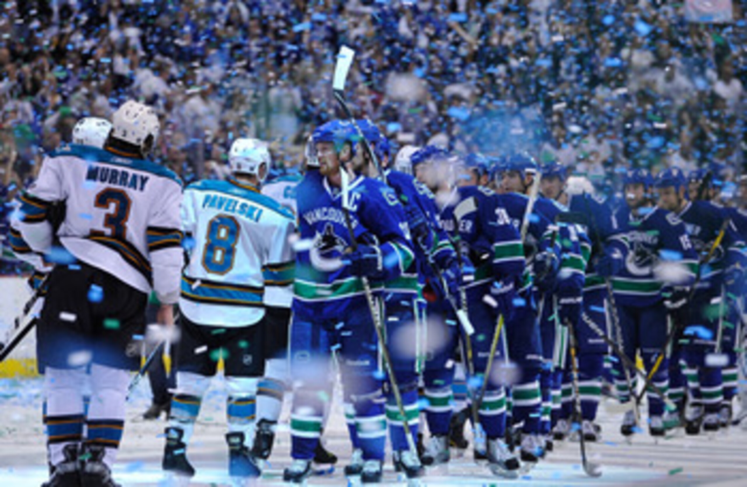 VANCOUVER, CANADA - MAY 24:  Captain Henrik Sedin #33 of the Vancouver Canucks leads his team for the post game handshake with the San Jose Sharks after winning Game Five of the Western Conference Finals 3-2 in the second overtime during the 2011 Stanley