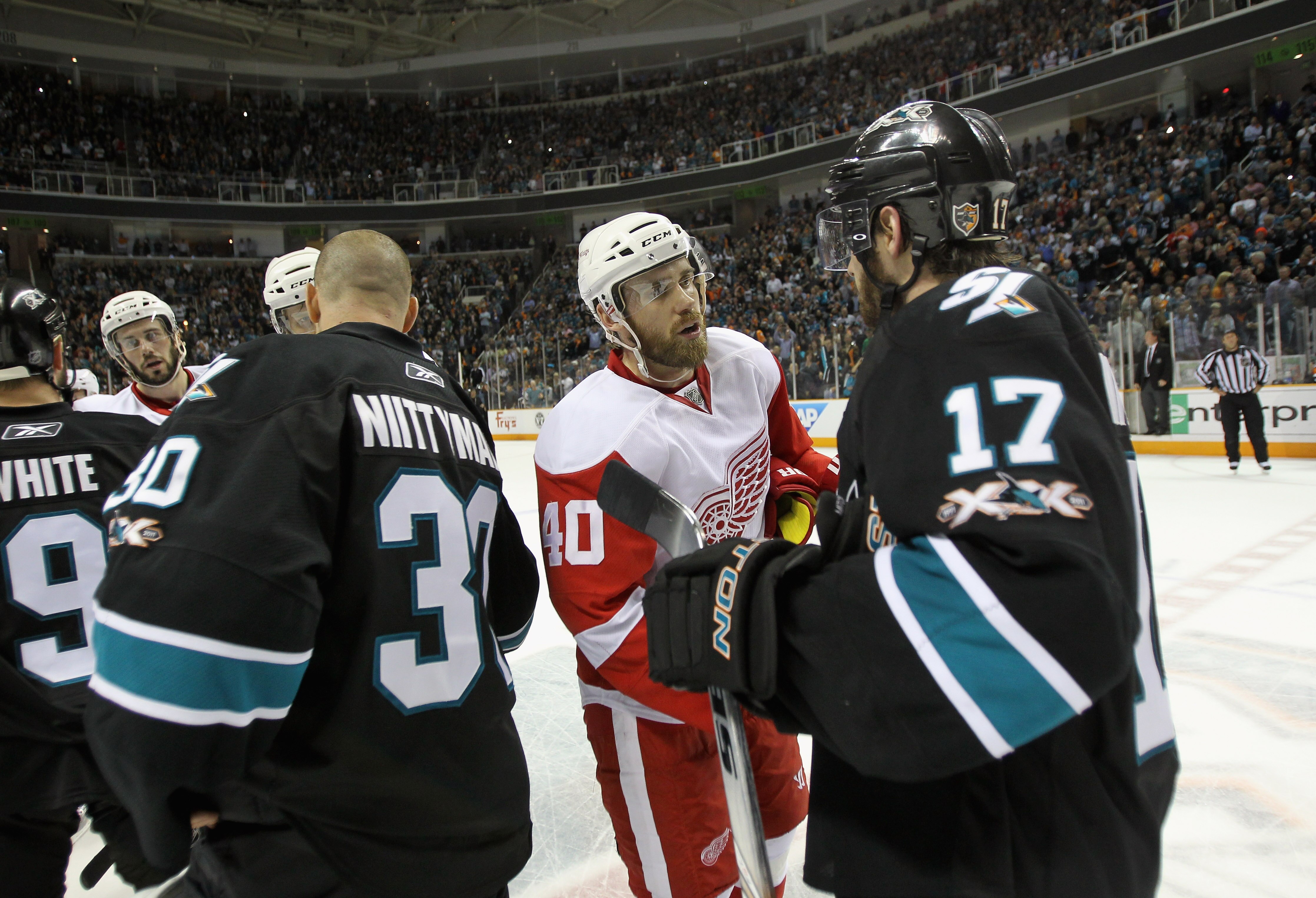 SAN JOSE, CA - MAY 12:  Henrik Zetterberg #40 of the Detroit Red Wings shakes hands with Torrey Mitchell #17 of the San Jose Sharks after Game Seven of the Western Conference Semifinals during the 2011 NHL Stanley Cup Playoffs at HP Pavilion on May 12, 20