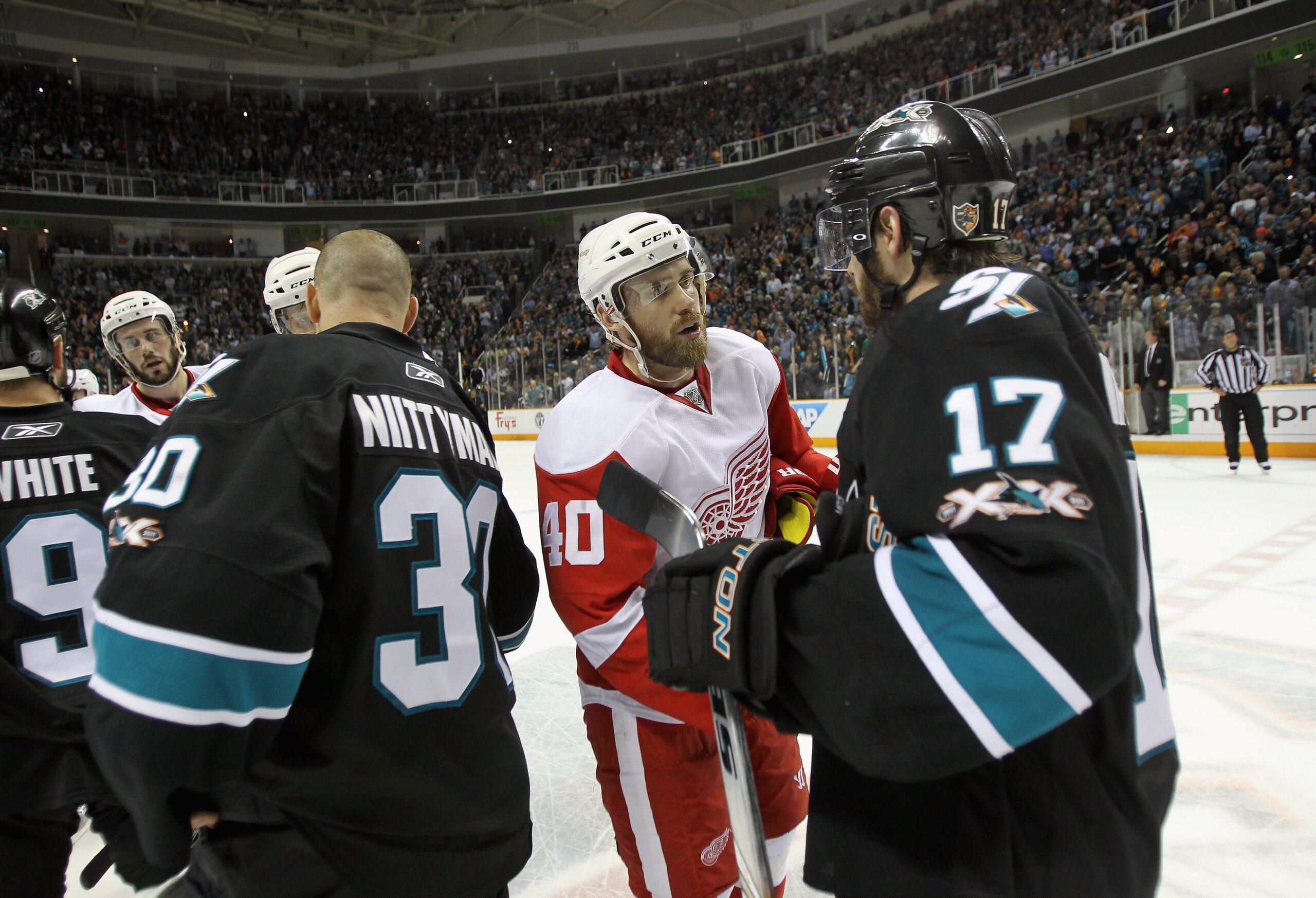 SAN JOSE, CA - MAY 12:  Henrik Zetterberg #40 of the Detroit Red Wings shakes hands with Torrey Mitchell #17 of the San Jose Sharks after Game Seven of the Western Conference Semifinals during the 2011 NHL Stanley Cup Playoffs at HP Pavilion on May 12, 20