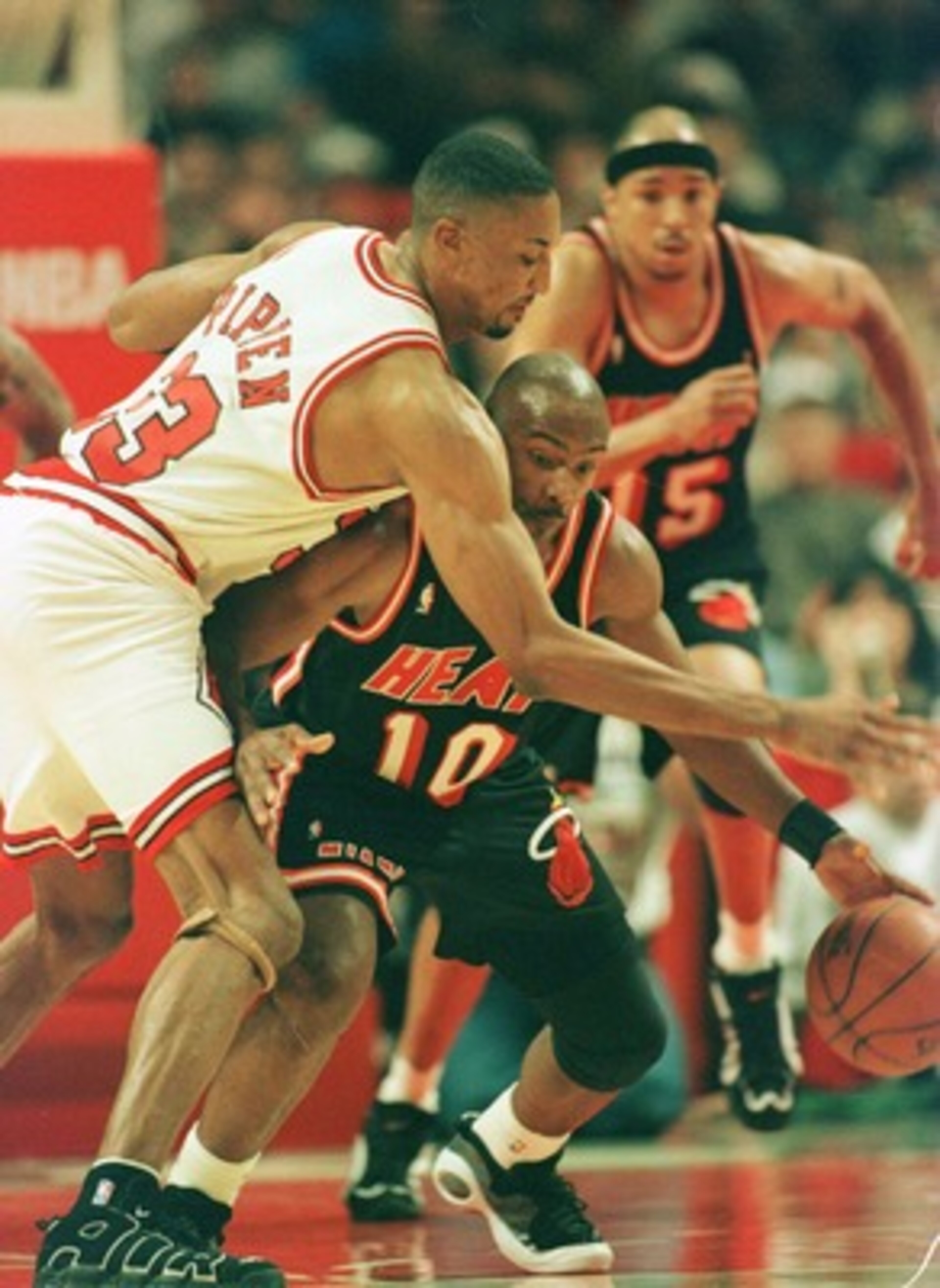 26 Apr 1996:  Point guard Tim Hardaway #10 of the Miami Heat dribbles up court while receiving defensive pressure by forward Scottie Pippen #33 of the Chicago Bulls during the Bulls first round playoff game against the Heat at the Ubited Center in Chicago