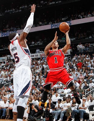 ATLANTA, GA - MAY 12:  Derrick Rose #1 of the Chicago Bulls shoots against Josh Smith #5 of the Atlanta Hawks in Game Six of the Eastern Conference Semifinals in the 2011 NBA Playoffs at Phillips Arena on May 12, 2011 in Atlanta, Georgia.  NOTE TO USER: U