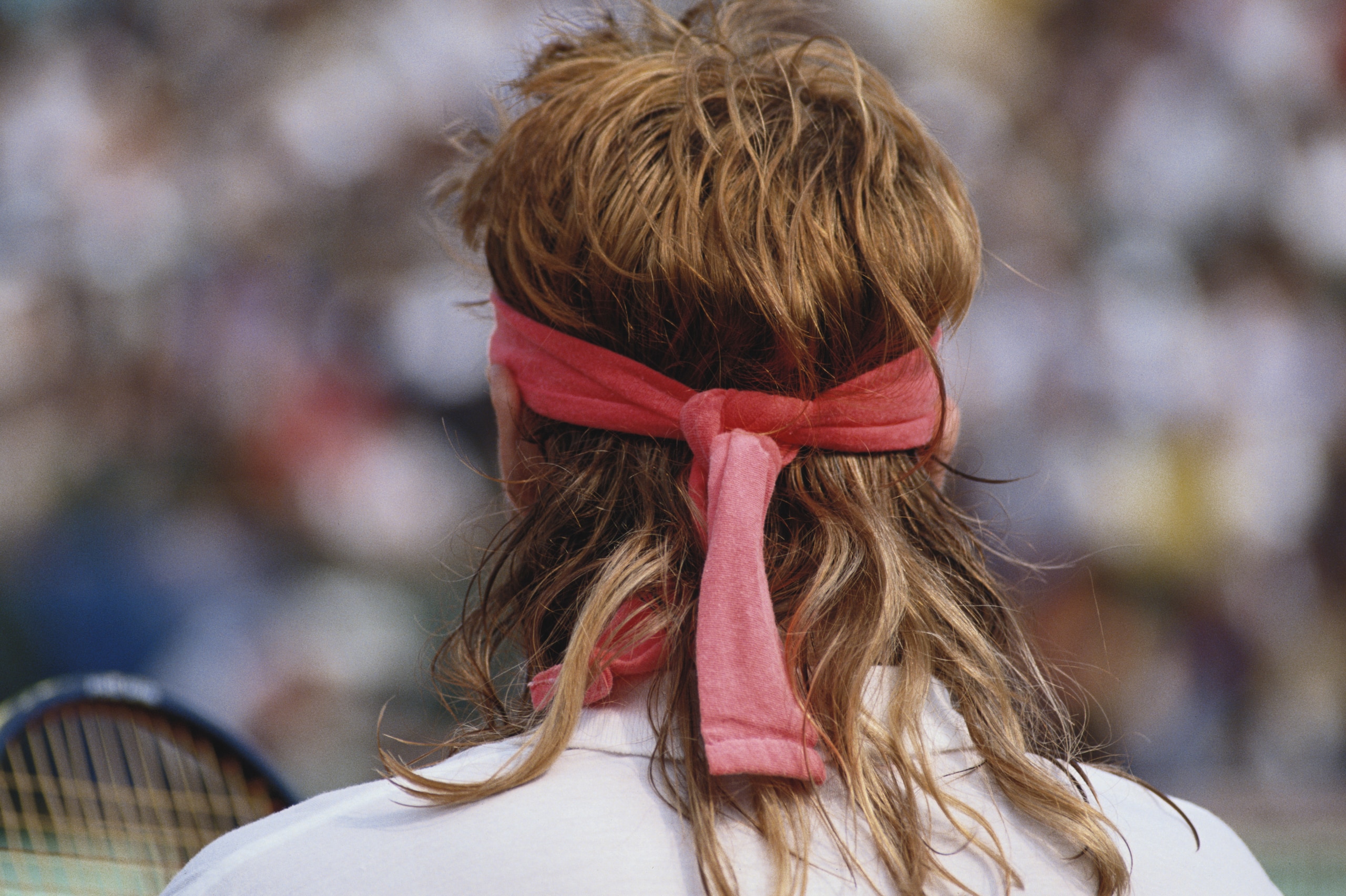 Andre Agassi of the United States wearing a toupee hairpiece during the Men's Singles final match against Andres Gomez during the French Open Tennis Championship on 10th June 1990 at the Stade Roland Garros Stadium in Paris, France. (Photo by Bob Martin/G