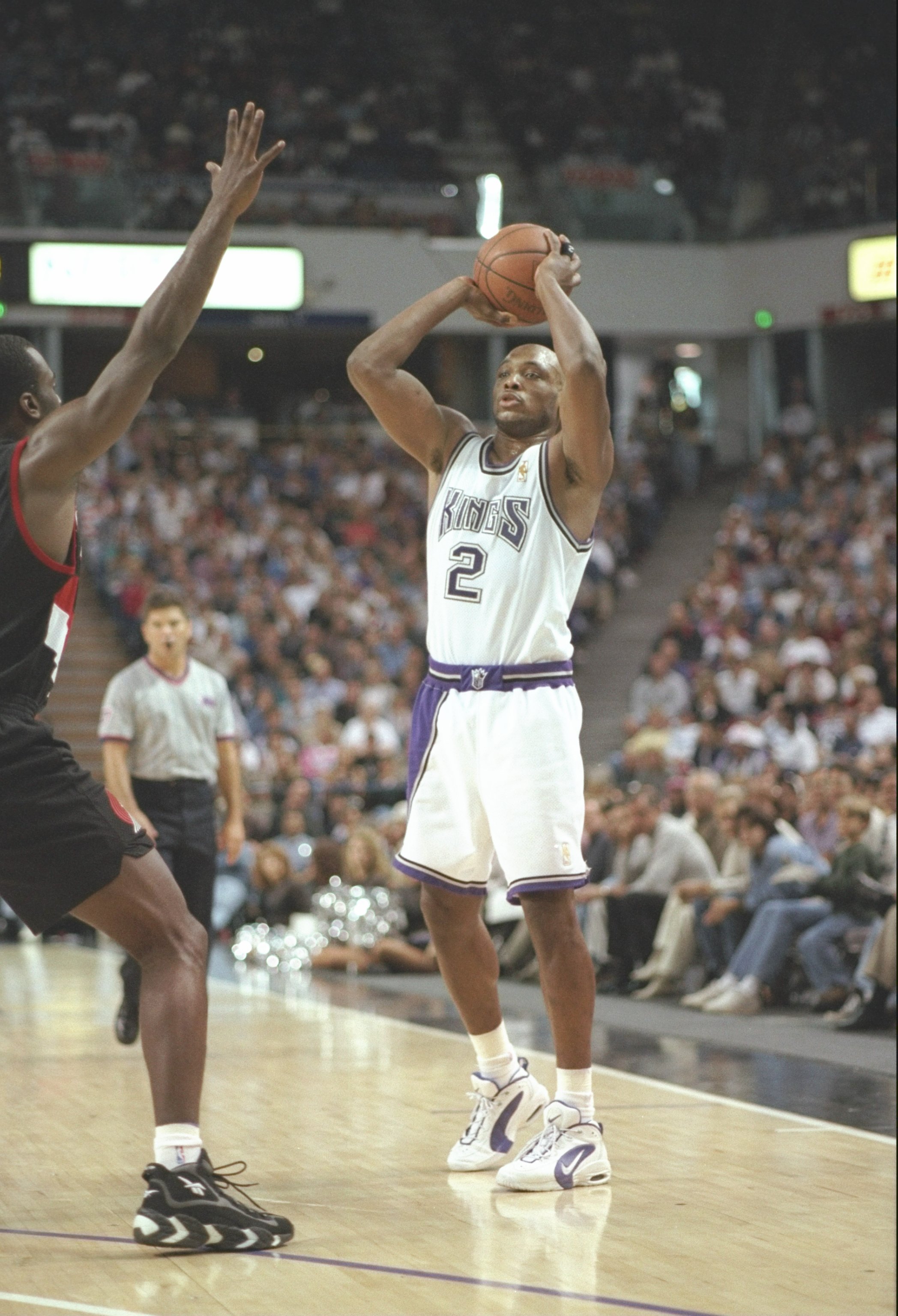 9 Nov 1996:  Guard Mitch Richmond of the Sacramento Kings looks to pass the ball during a game against the Portland Trailblazers at the Arco Arena in Sacramento, California.  The Kings won the game 103-102. Mandatory Credit: Otto Greule  /Allsport