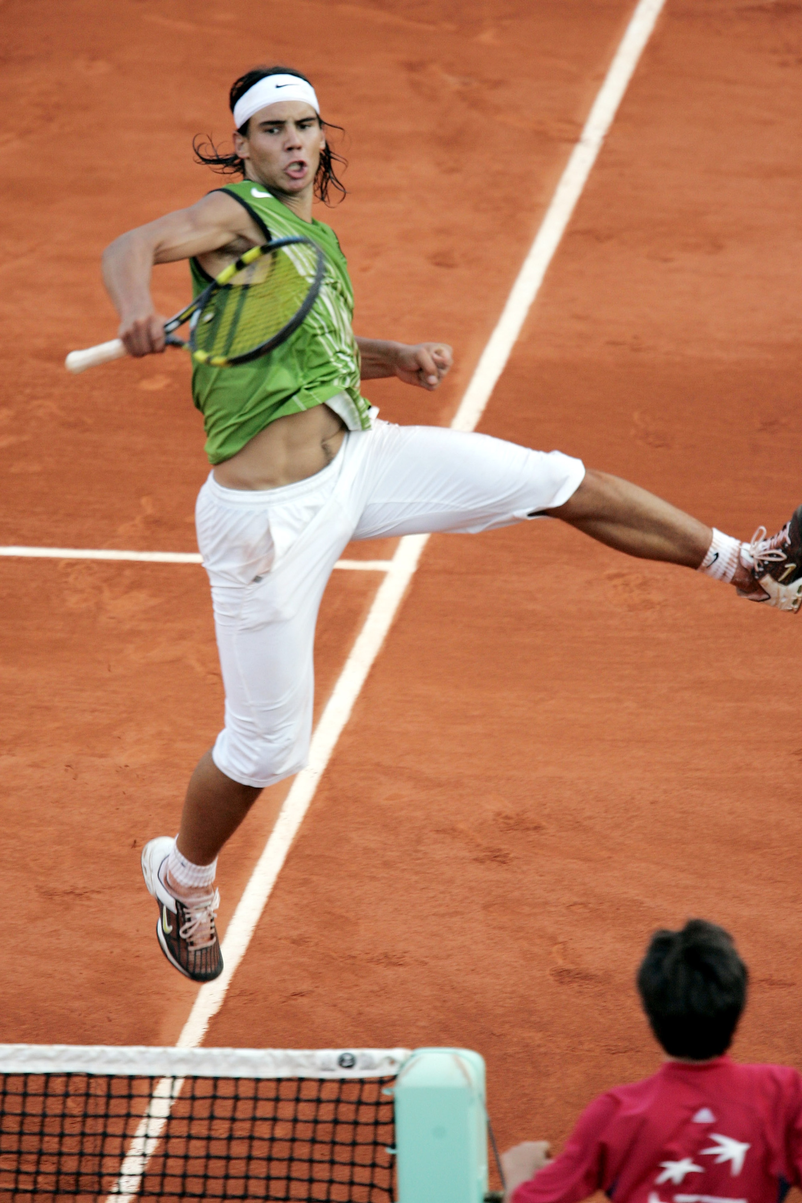 PARIS - JUNE 3:  Rafael Nadal of Spain celebrates winning a point during his semi-final match against Roger Federer of Switzerland during the twelfth day of the French Open at Roland Garros on June 3, 2005 in Paris, France. (Photo by Clive Mason/Getty Ima