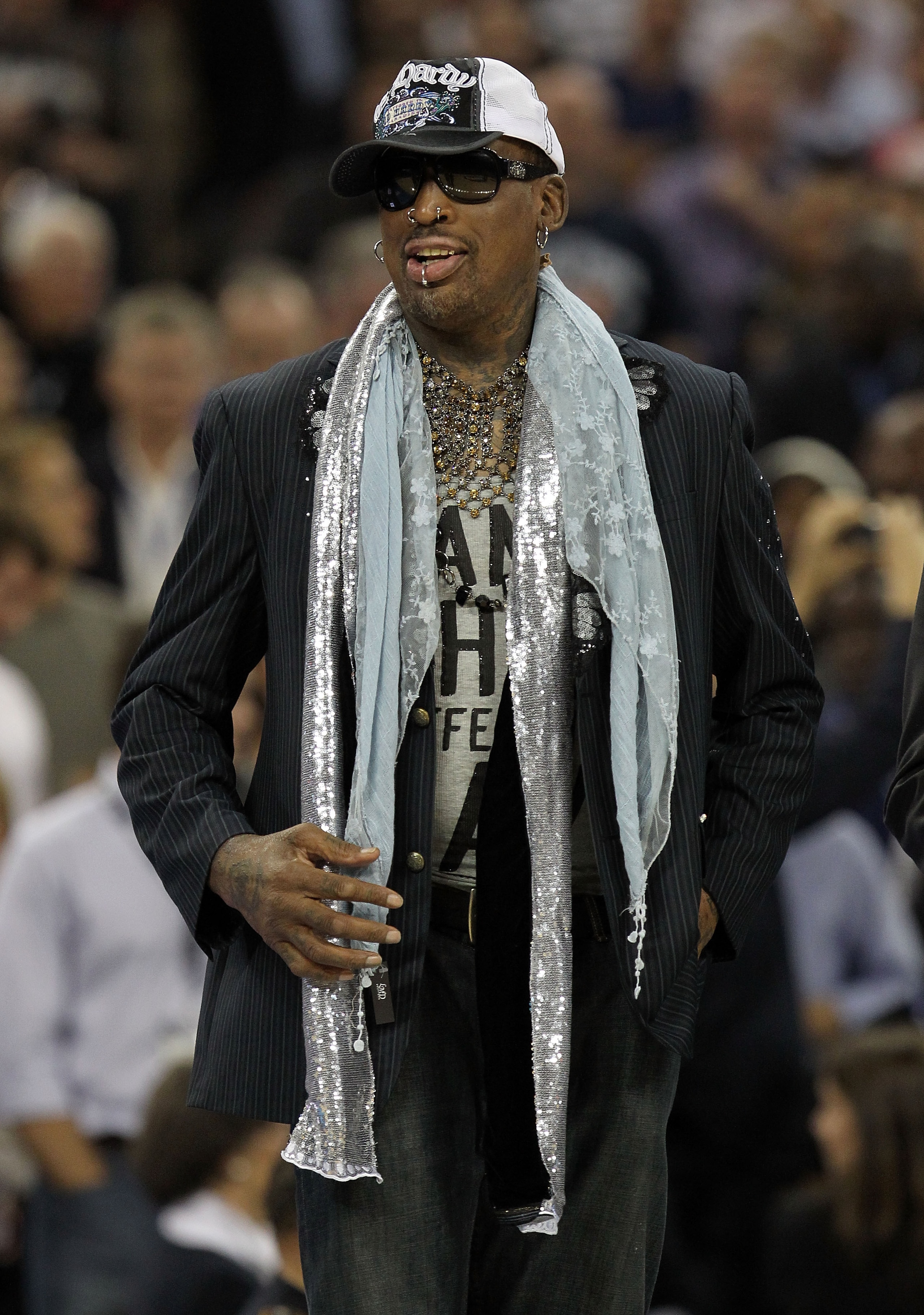 HOUSTON, TX - APRIL 04:  Naismith Memorial Basketball Hall of Fame 2011 inductee Dennis Rodman looks on during halftime of the National Championship Game of the 2011 NCAA Division I Men's Basketball Tournament at Reliant Stadium on April 4, 2011 in Housto