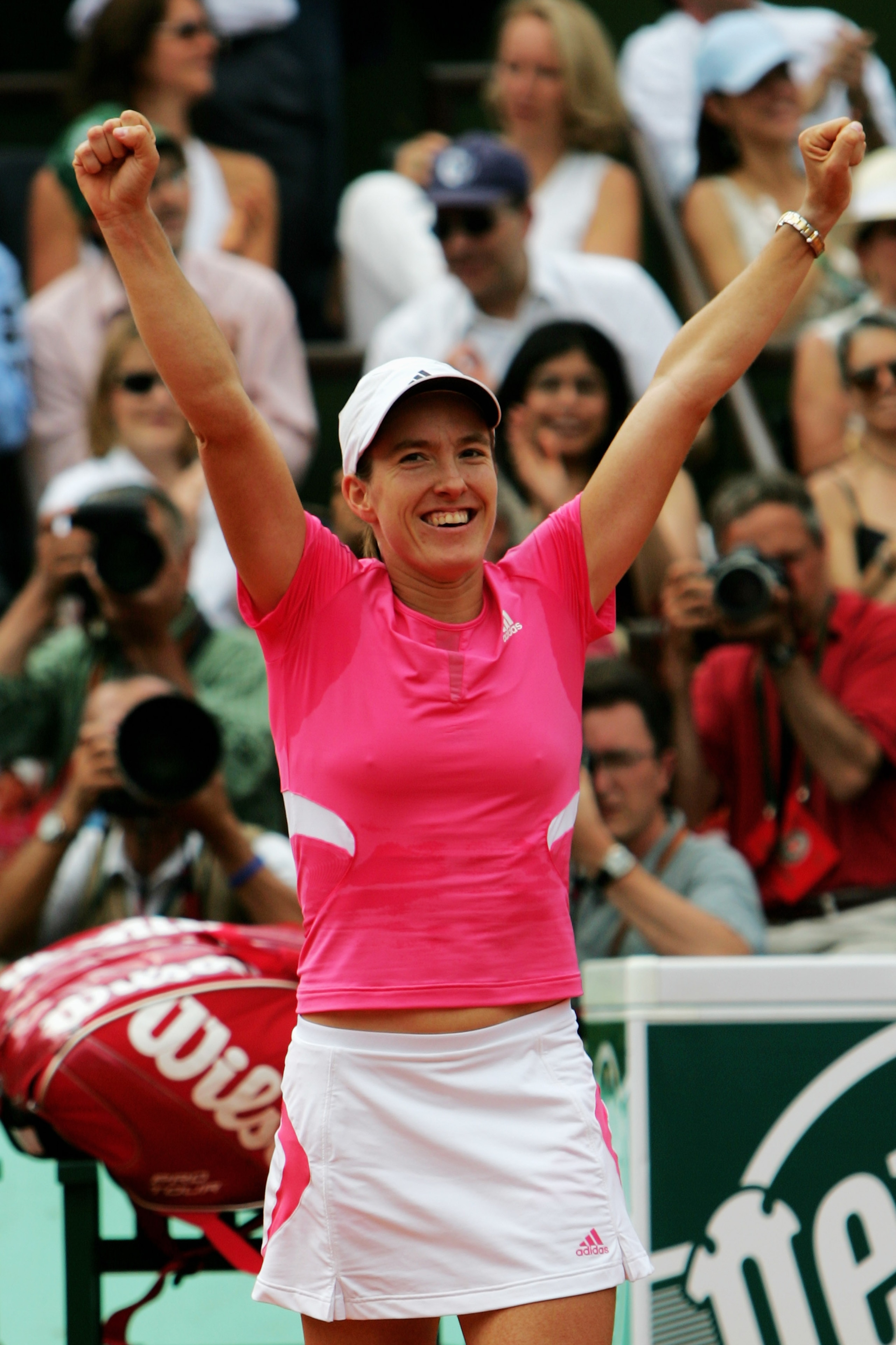 PARIS - JUNE 09:  Justine Henin of Belgium celebrates winning the match against Ana Ivanovic of Serbia during the Women's Singles Final on day fourteen of the French Open at Roland Garros on June 9, 2007 in Paris, France.  (Photo by Dean Mouhtaropoulos/Ge