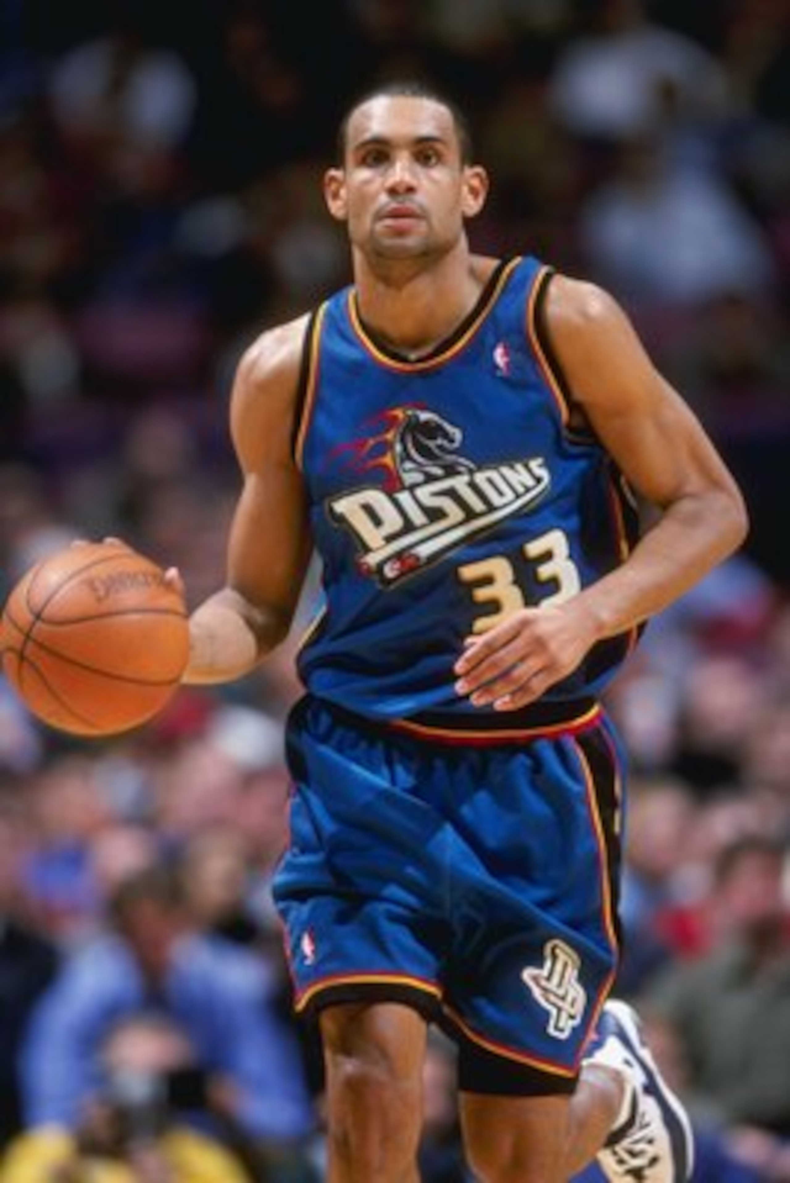 24 Mar 1999: Grant Hill #33 of the Detroit Pistons dribbles the ball during a game against the New Jersey Nets at the Continental Airlines Arena in East Rutherford, New Jersey. The Piston defeated the Nets 84-71.