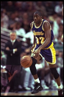 26 Mar 1996:  Guard Magic Johnson of the Los Angeles Lakers moves the ball against the Orlando Magic during a game played at the Orlando Arena in Orlando, Florida.  The Lakers won the game, 113-91. Mandatory Credit: ALLSPORT USA  /Allsport