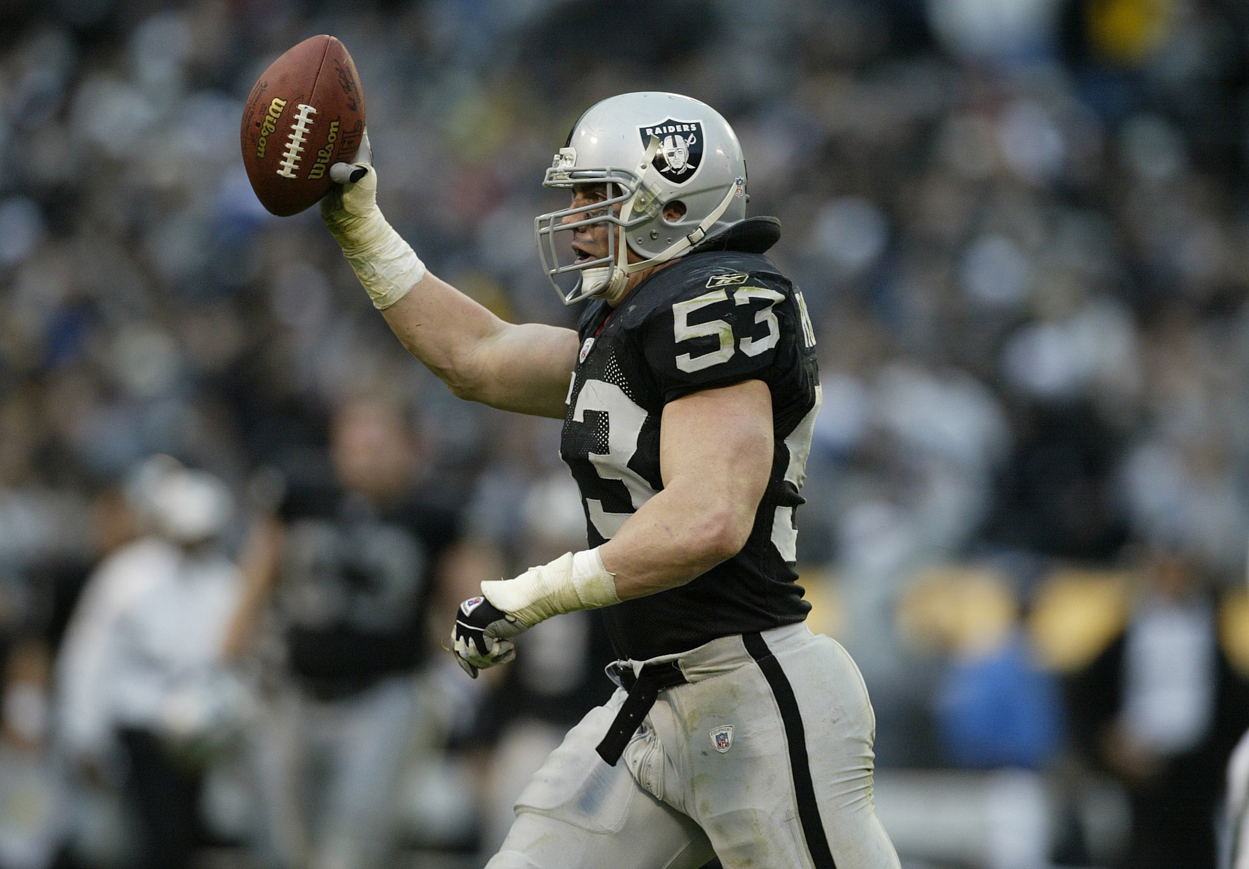 OAKLAND, CA - JANUARY 12:  Bill Romanowski #53 of the Oakland Raiders celebrates after recovering a fumble against the New York Jets during the AFC Divisional Playoff game at Network Associates Coliseum on January 12, 2003 in Oakland, California.  (Photo