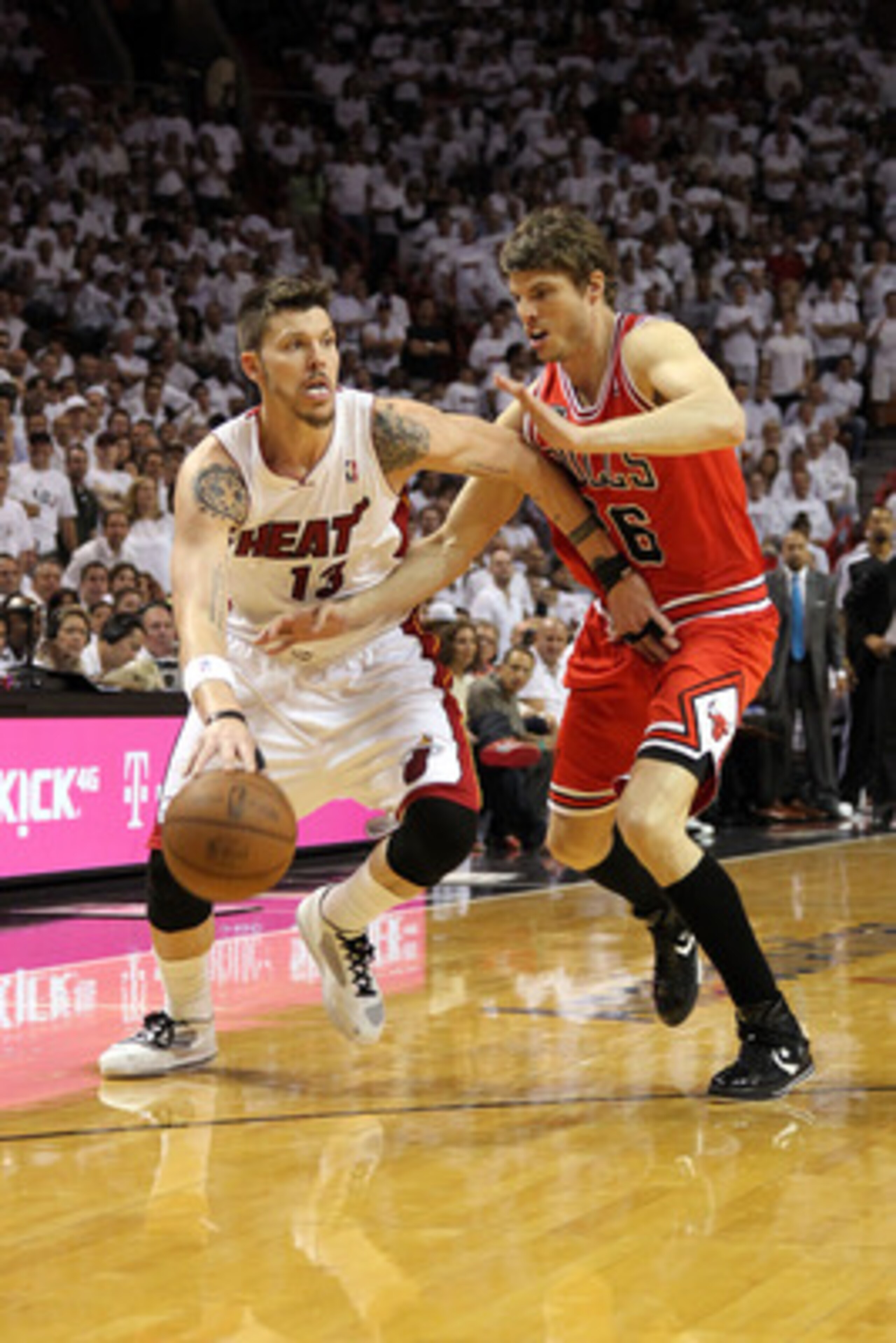 MIAMI, FL - MAY 24:  Mike Miller #13 of the Miami Heat drives against Kyle Korver #26 of the Chicago Bulls in Game Four of the Eastern Conference Finals during the 2011 NBA Playoffs on May 24, 2011 at American Airlines Arena in Miami, Florida. The Heat wo
