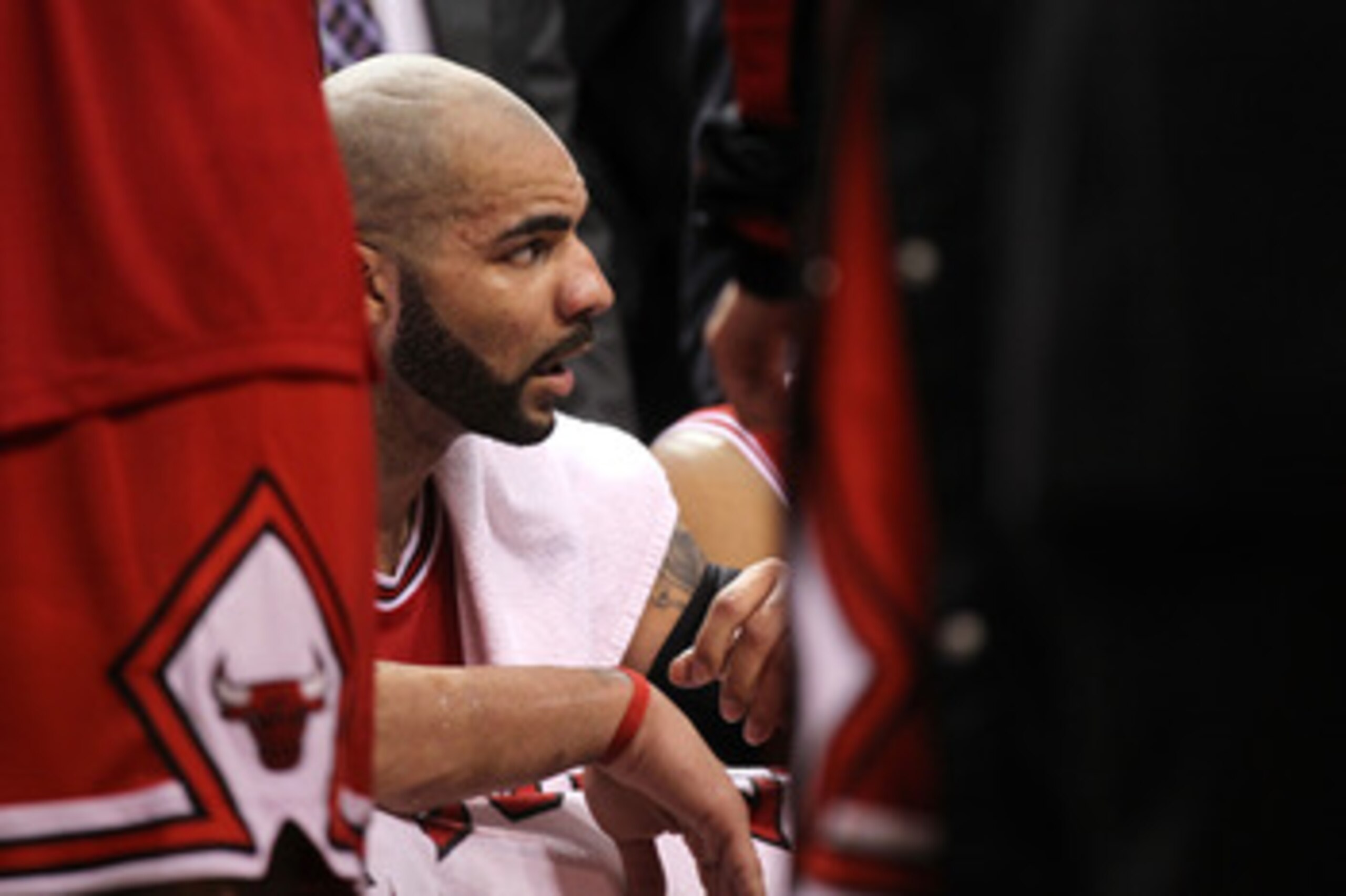 MIAMI, FL - MAY 22:  Carlos Boozer #5 of the Chicago Bulls looks on from the bench against the Miami Heat in Game Three of the Eastern Conference Finals during the 2011 NBA Playoffs on May 22, 2011 at American Airlines Arena in Miami, Florida.  NOTE TO US