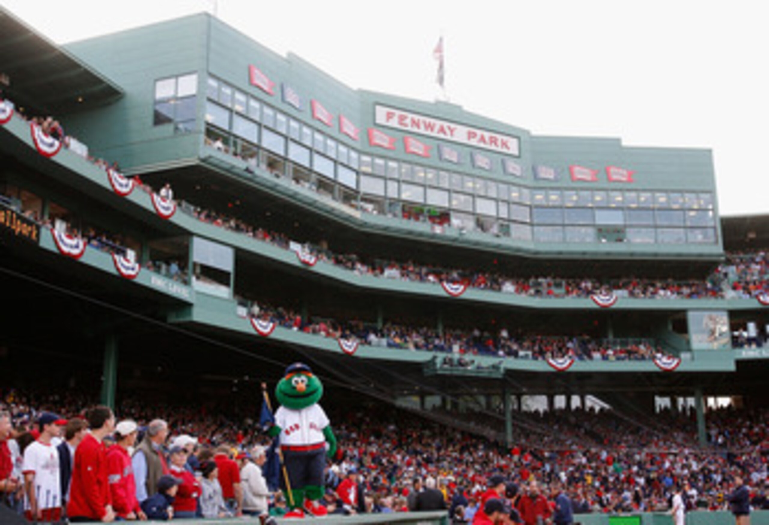 BOSTON - OCTOBER 13:  The Boston Red Sox mascot, Wally the Green Monster stands on the dugout inbetween innings of game three of the American League Championship Series against the Tampa Bay Rays during the 2008 MLB playoffs at Fenway Park on October 13, 