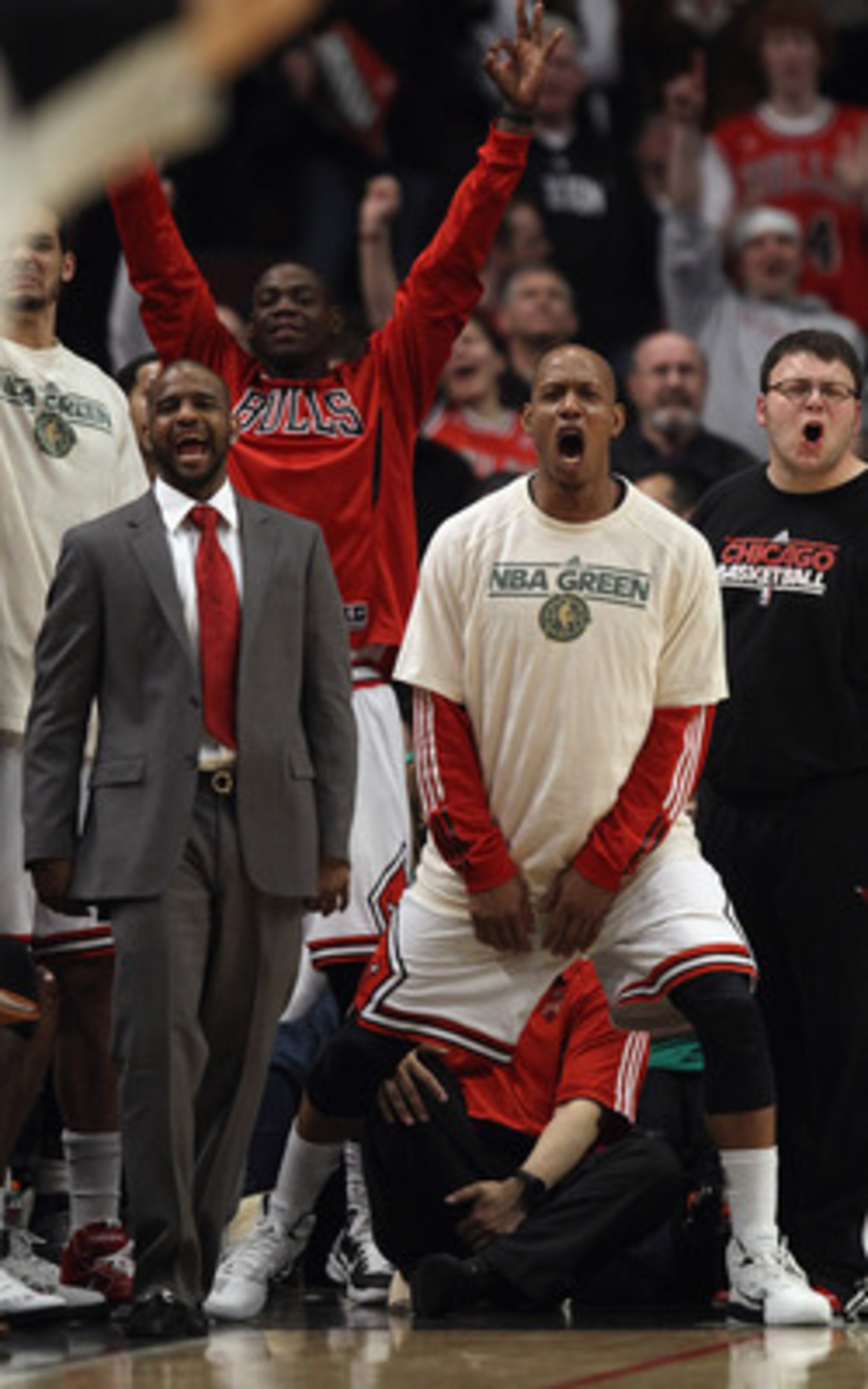 CHICAGO, IL - APRIL 07: Keith Bogans #6 of the Chicago Bulls (R) is joined by players on the bench cheering on teammates against the Boston Celtics at United Center on April 7, 2011 in Chicago, Illinois. The Bulls defeated the Celtics 97-81. NOTE TO USER: