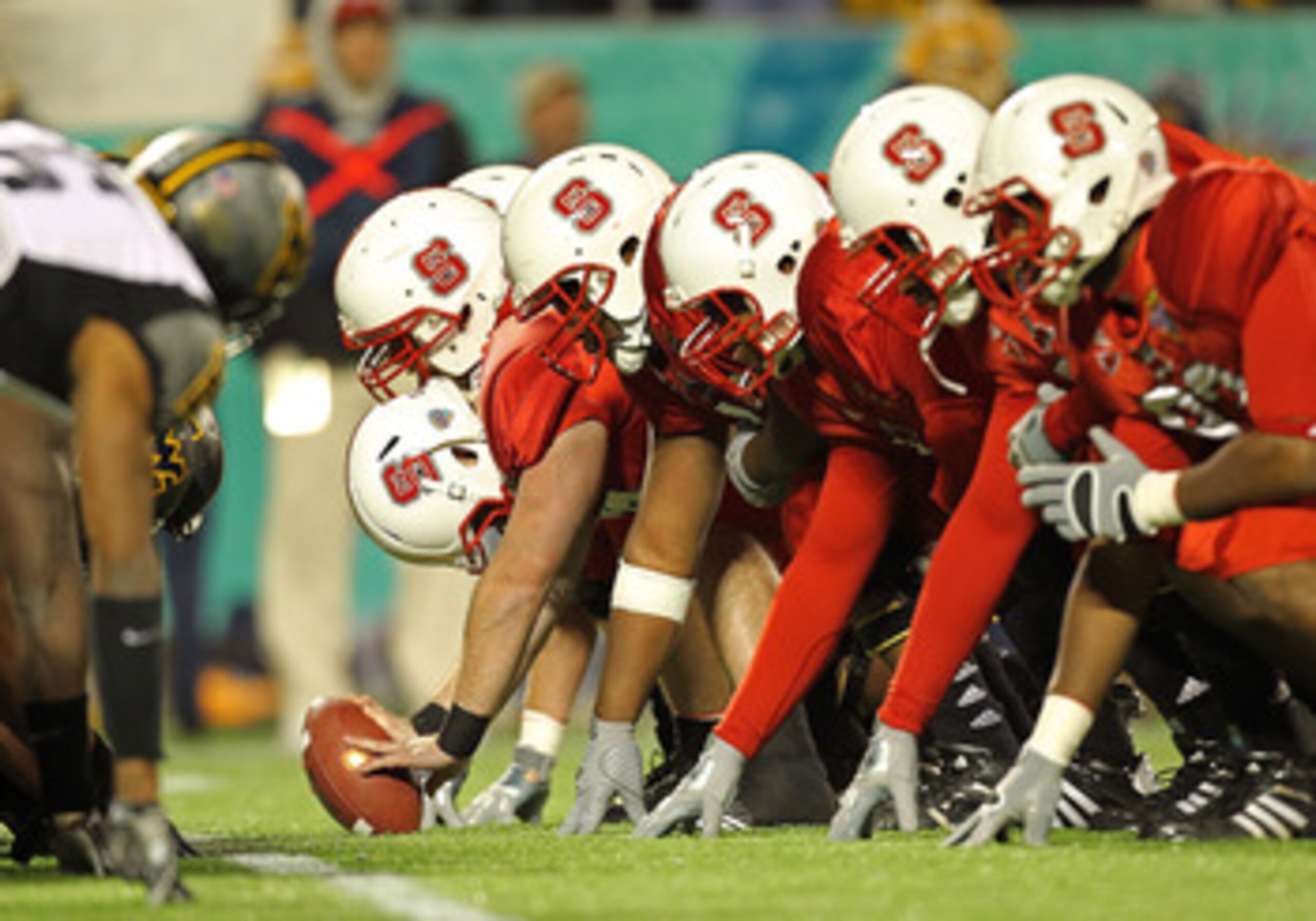 ORLANDO, FL - DECEMBER 28: The North Carolina State Wolfpack snap the ball during the Champs Sports Bowl against the West Virginia Mountineers at Florida Citrus Bowl Stadium on December 28, 2010 in Orlando, Florida. (Photo by Mike Ehrmann/Getty Images) ORLANDO, FL - DECEMBER 28: The North Carolina State Wolfpack snap the ball during the Champs Sports Bowl against the West Virginia Mountineers at Florida Citrus Bowl Stadium on December 28, 2010 in Orlando, Florida. (Photo by Mike Ehrmann/Getty Images)