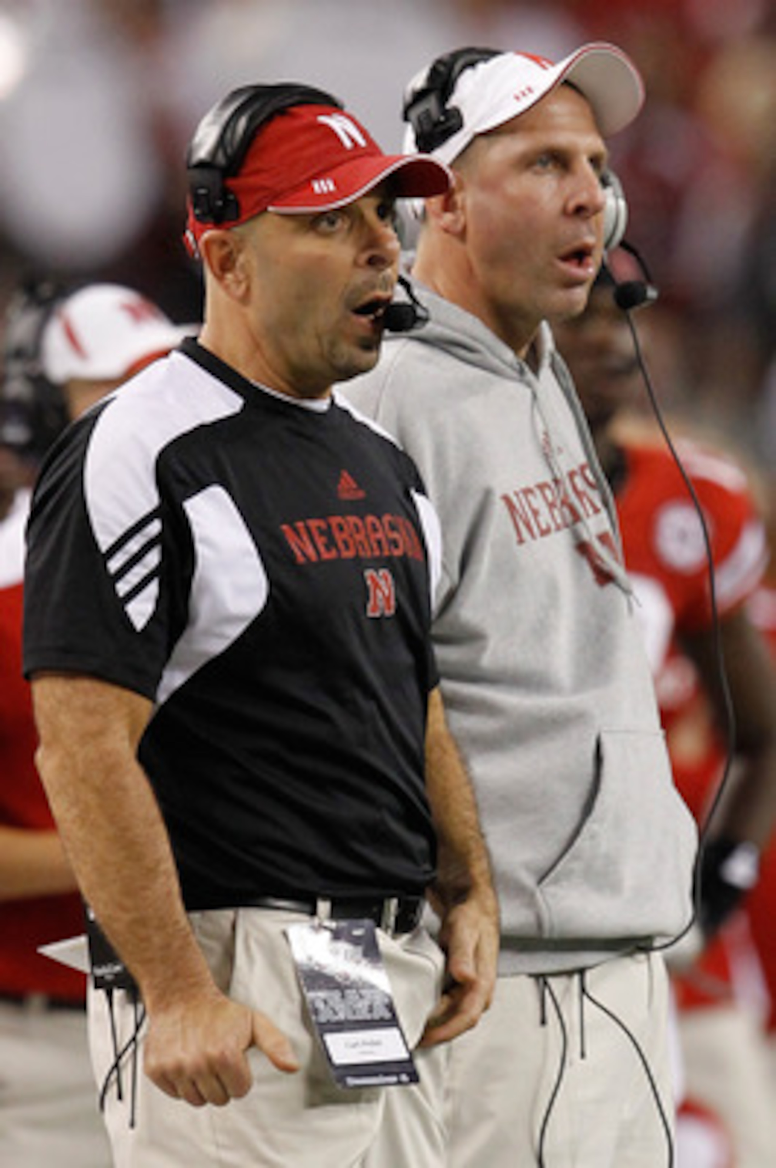 ARLINGTON, TX - DECEMBER 04: Head coach Bo Pelini (R) of the Nebraska Cornhuskers and defensive coordinator Carl Pelini lead their team against the Oklahoma Sooners at Cowboys Stadium on December 4, 2010 in Arlington, Texas. The Sooners beat the Cornhusk ARLINGTON, TX - DECEMBER 04: Head coach Bo Pelini (R) of the Nebraska Cornhuskers and defensive coordinator Carl Pelini lead their team against the Oklahoma Sooners at Cowboys Stadium on December 4, 2010 in Arlington, Texas. The Sooners beat the Cornhusk