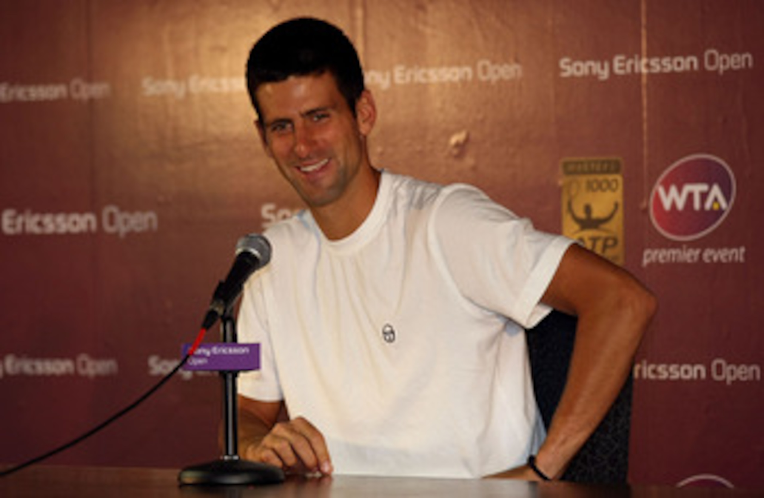 KEY BISCAYNE, FL - MARCH 24:  Novak Djokovic of Serbia answers questions from the media at a press conference during the Sony Ericsson Open at Crandon Park Tennis Center on March 24, 2011 in Key Biscayne, Florida.  (Photo by Chris Chambers/Getty Images)