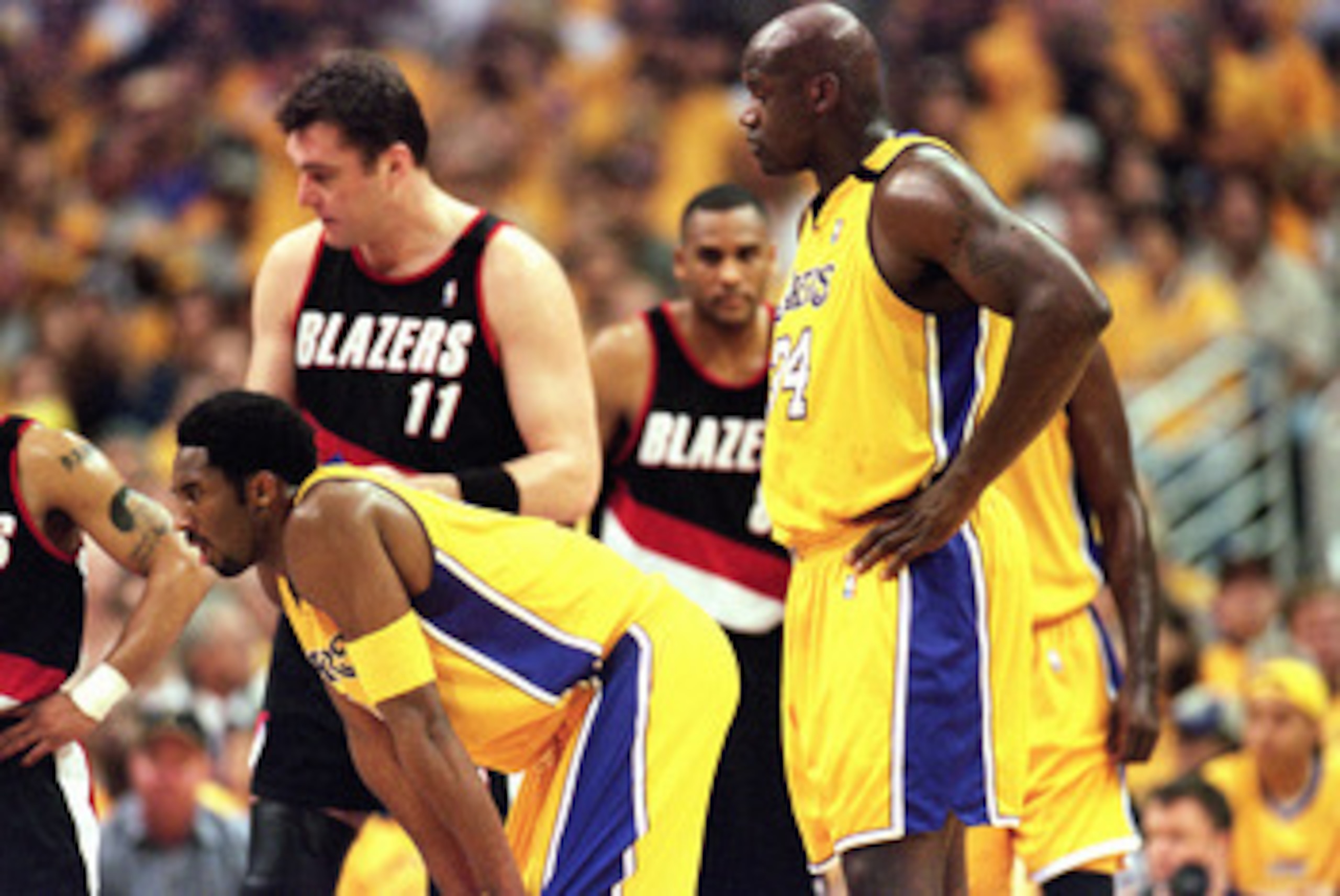 LOS ANGELES - JUNE 4:  Kobe Bryant #8 and Shaquille O'Neal #34 of the Los Angeles Lakers stand on the court during Game 7 of the Western Conference Finals against the Portland Trail Blazers at Staples Center on June 4, 2000 in Los Angeles, California. The