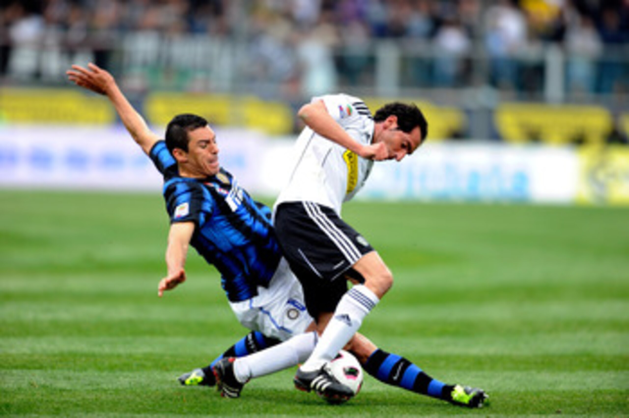 CESENA, ITALY - APRIL 30:  Lucio of FC Inter Milan and Fabio Caserta of AC Cesena compete for the ball during the Serie A match between AC Cesena and FC Internazionale Milano at Dino Manuzzi Stadium on April 30, 2011 in Cesena, Italy.  (Photo by Claudio V