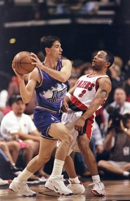 22 May 1999:  John Stockton #12 of the Utah Jazz moves with the ball around Damon Stoudamire #3 of the Portland Trail Blazers during game three of the NBA Western Conference Semifinals at the Rose Garden in Portland, Oregon. The Trail Blazers defeated the