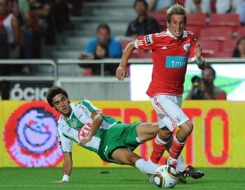 LISBON, PORTUGAL - AUGUST 28:  Fabio Coentrao (R) of Benfica tackles Paulo Regula (L) of Vitoria Setubal during the Portuguese Liga match between Benfica and Vitoria Setubal at Luz Stadium on August 28, 2010 in Lisbon, Portugal.  (Photo by Patricia de Mel