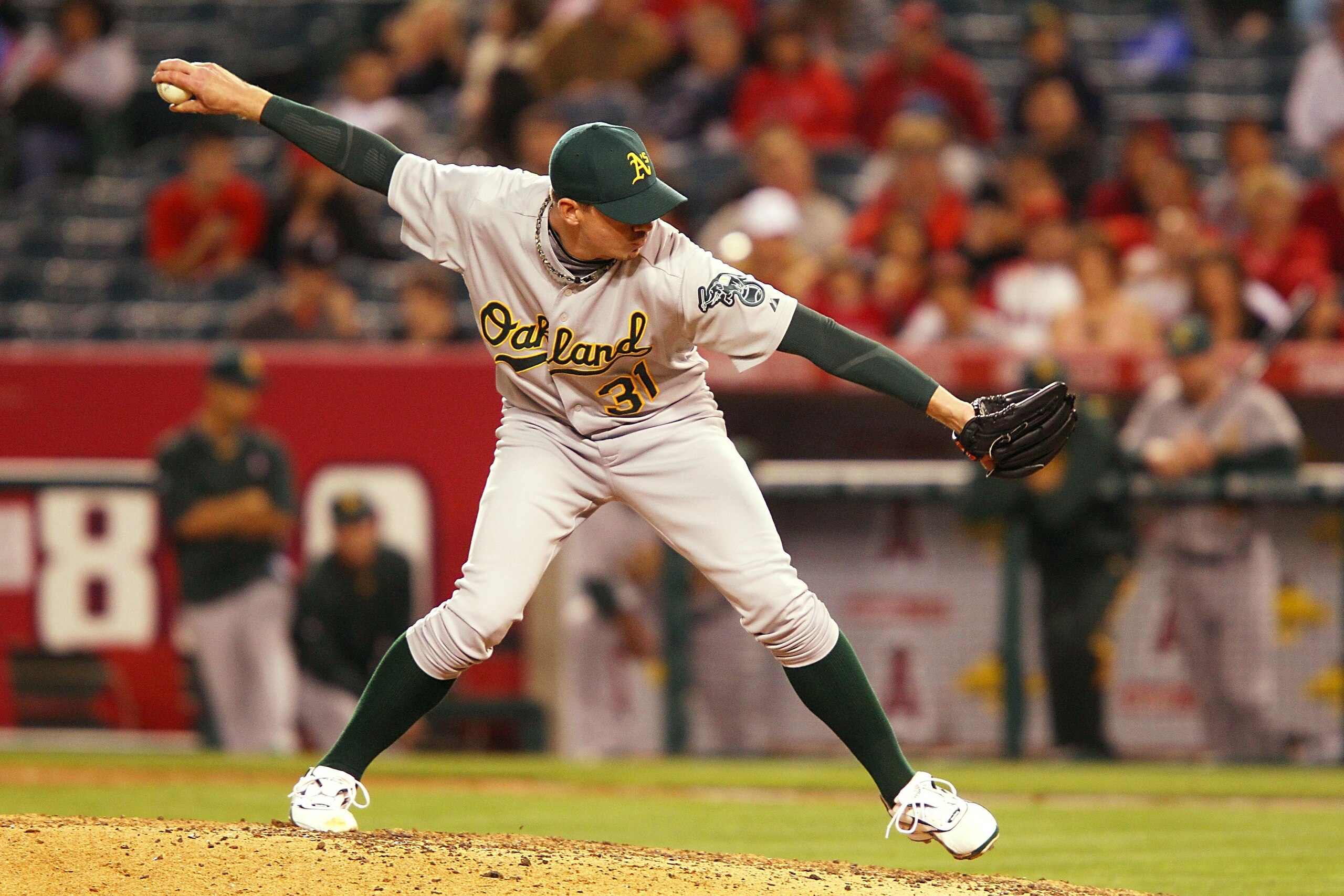 ANAHEIM, CA - MAY 24:  Brad Ziegler #31 of the Oakland Athletics pitches in the ninth inning against the Los Angeles Angels of Anaheim during the game at Angel Stadium on May 24, 2011 in Anaheim, California.  (Photo by Joe Scarnici/Getty Images)