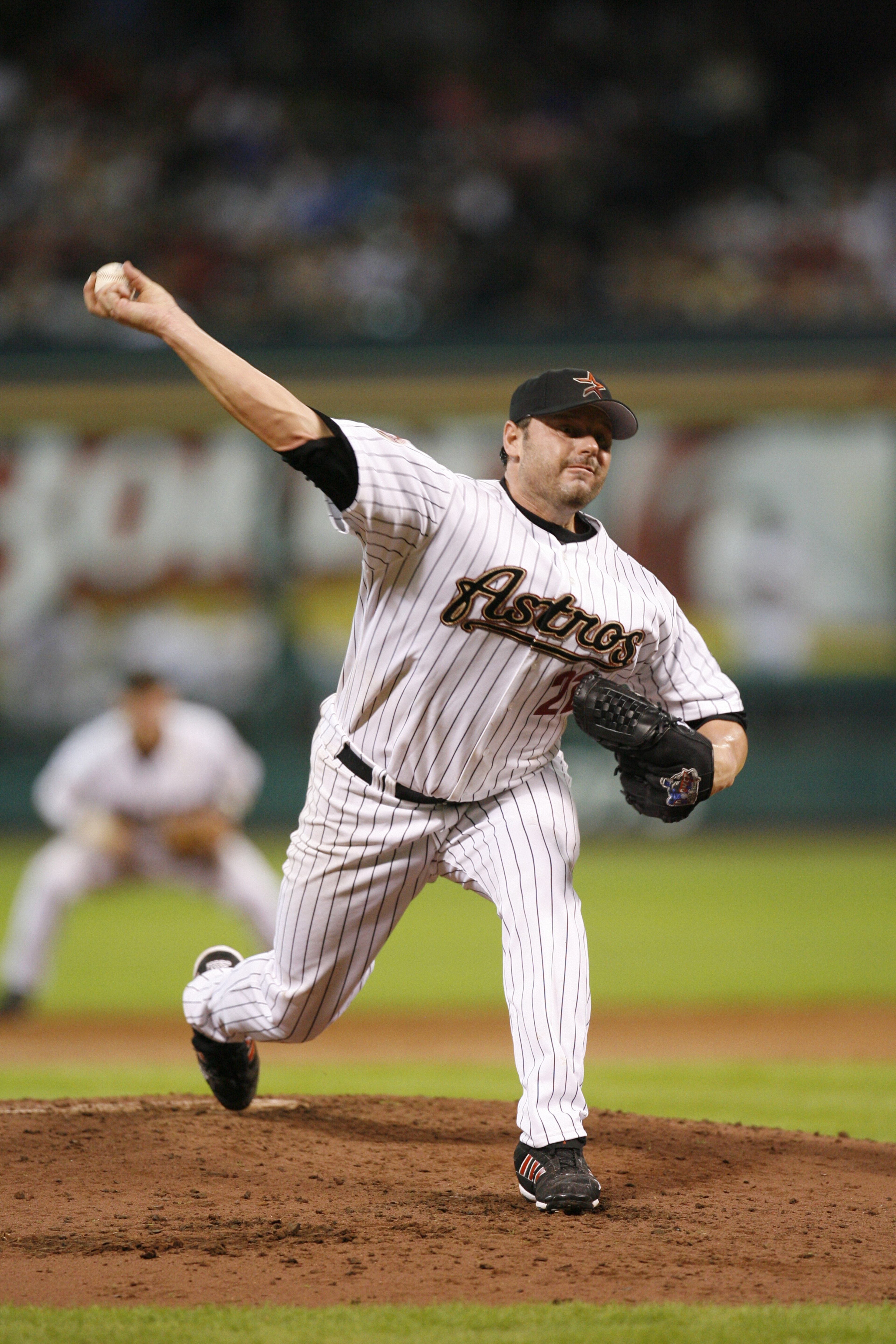 HOUSTON - JUNE 22:  Roger Clemens #22 of the Houston Astros pitches against the Minnesota Twins at Minute Maid Park on June 22, 2006 in Houston, Texas. The Twins defeated the Astros 4-2. (Photo by Bill Baptist/Getty Images)