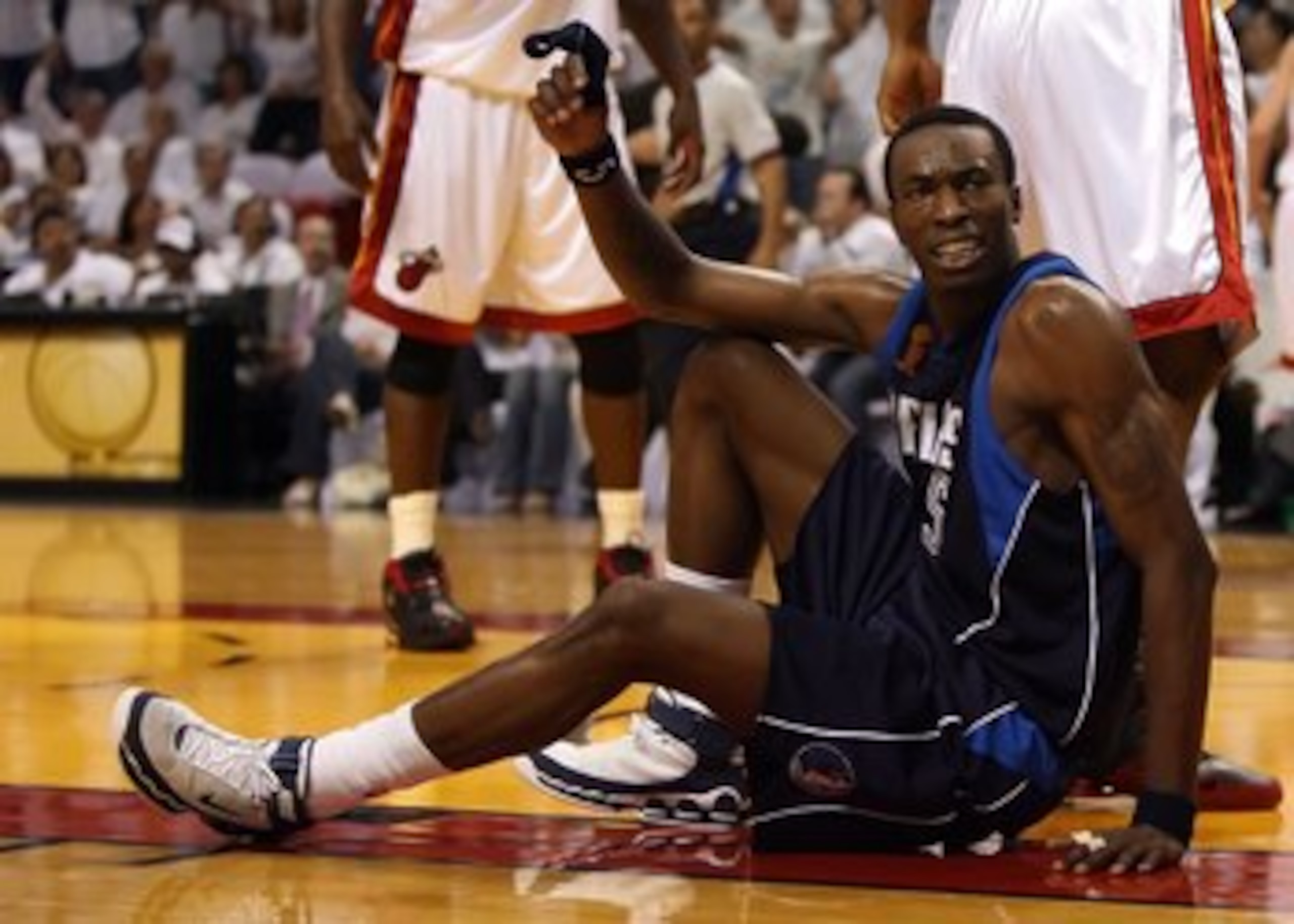 MIAMI - JUNE 13:  Josh Howard #5 of the Dallas Mavericks is on the ground late in the fourth quarter of game three of the 2006 NBA Finals against the Miami Heat on June 13, 2006 at American Airlines Arena in Miami, Florida.  The Heat defeated the Mavs 98-