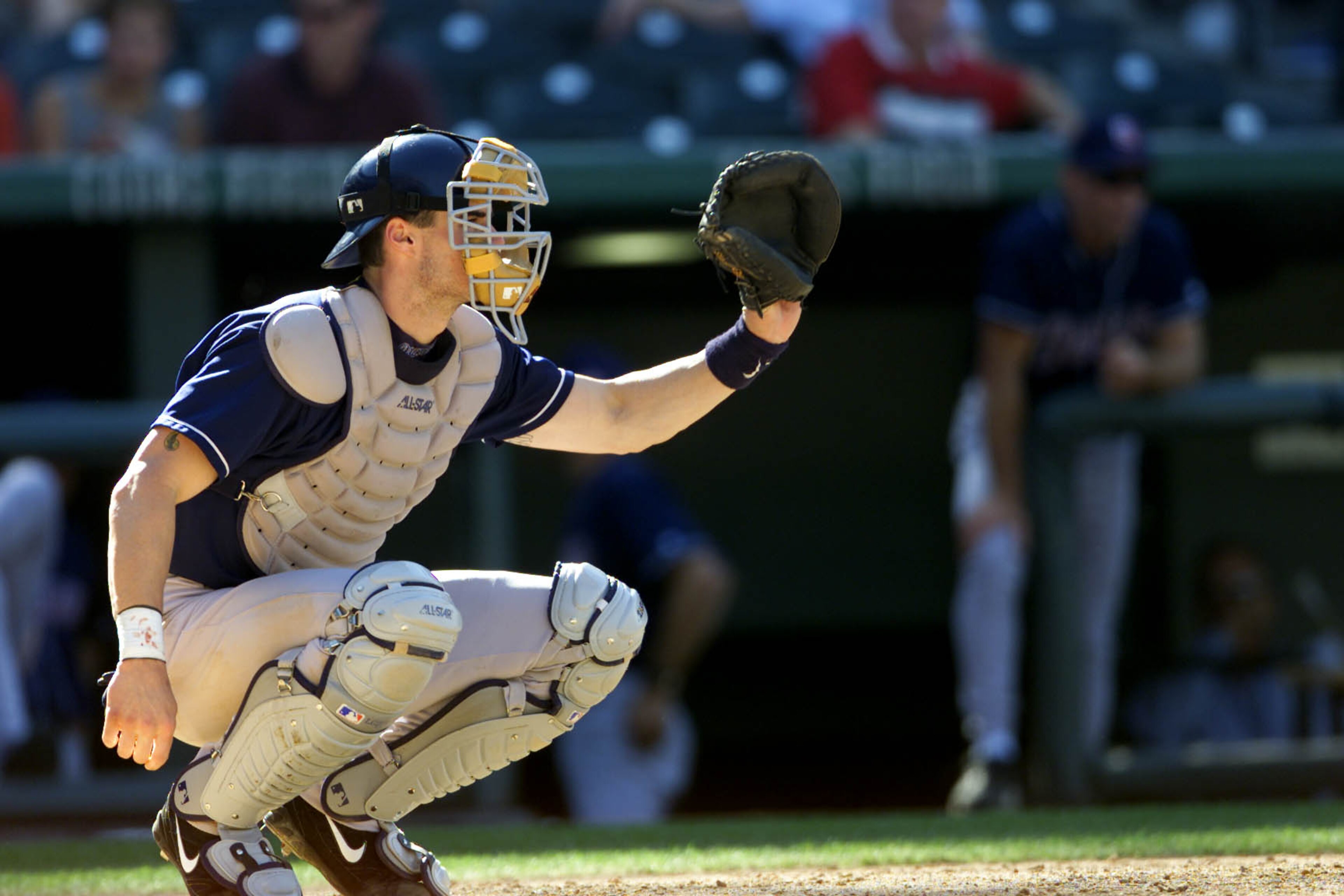 27 Sep 2001: Catcher Ben Davis of the San Diego padres aims for a save against the Colorado Rockies during the game at Coors Field in Denver, Colorado. The Rockies won 13-9 . DIGITAL IMAGE. Mandatory Credit: Brian Bahr/Allsport