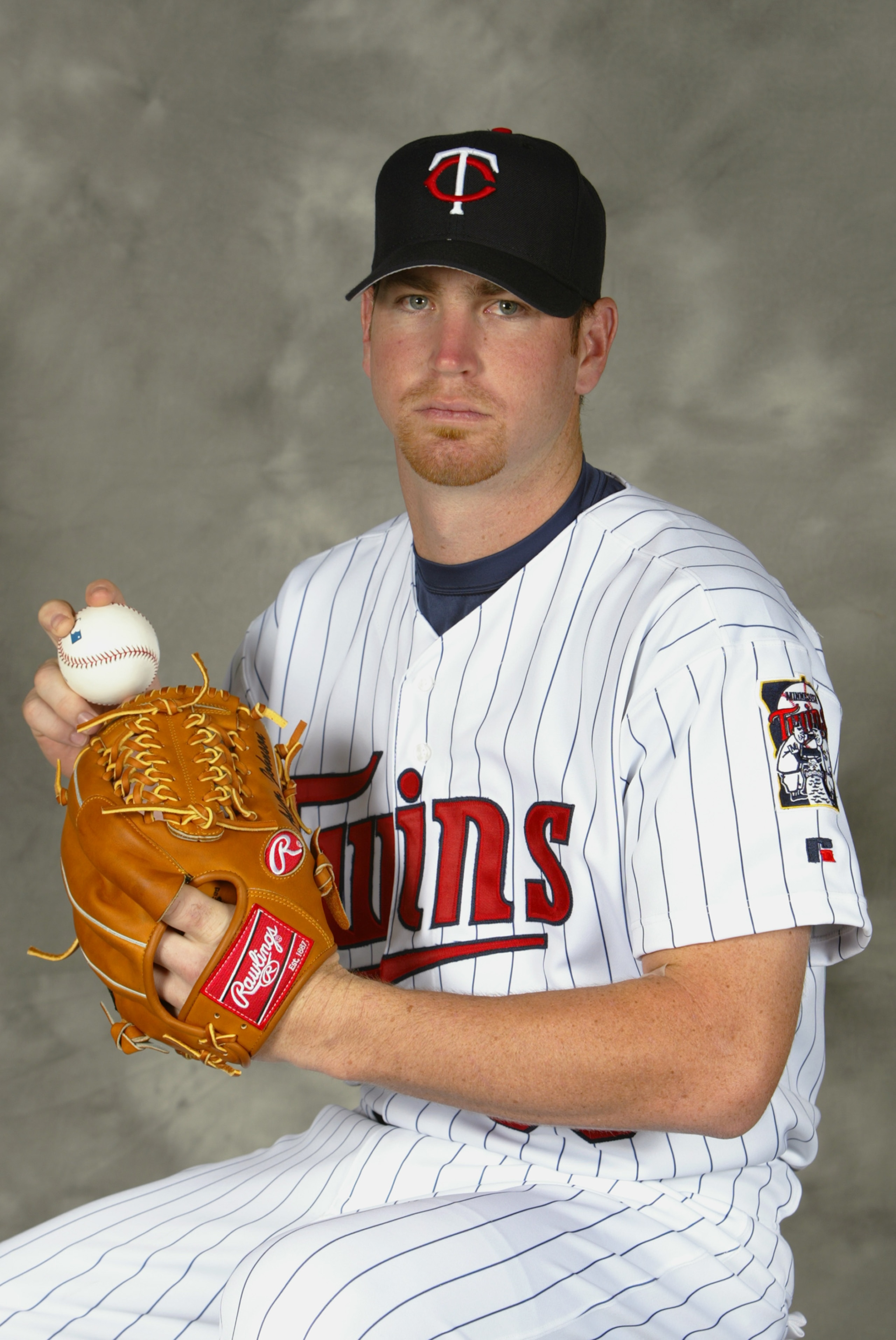FT. MYERS, FL - MARCH 1:  Pitcher Adam Johnson #38 of the Minnesota Twins poses for portrait during Twins Photo Day at the Twins Spring Training Complex on March 1, 2004 in Fort Myers, Florida.  (Photo by Ezra Shaw/Getty Images)