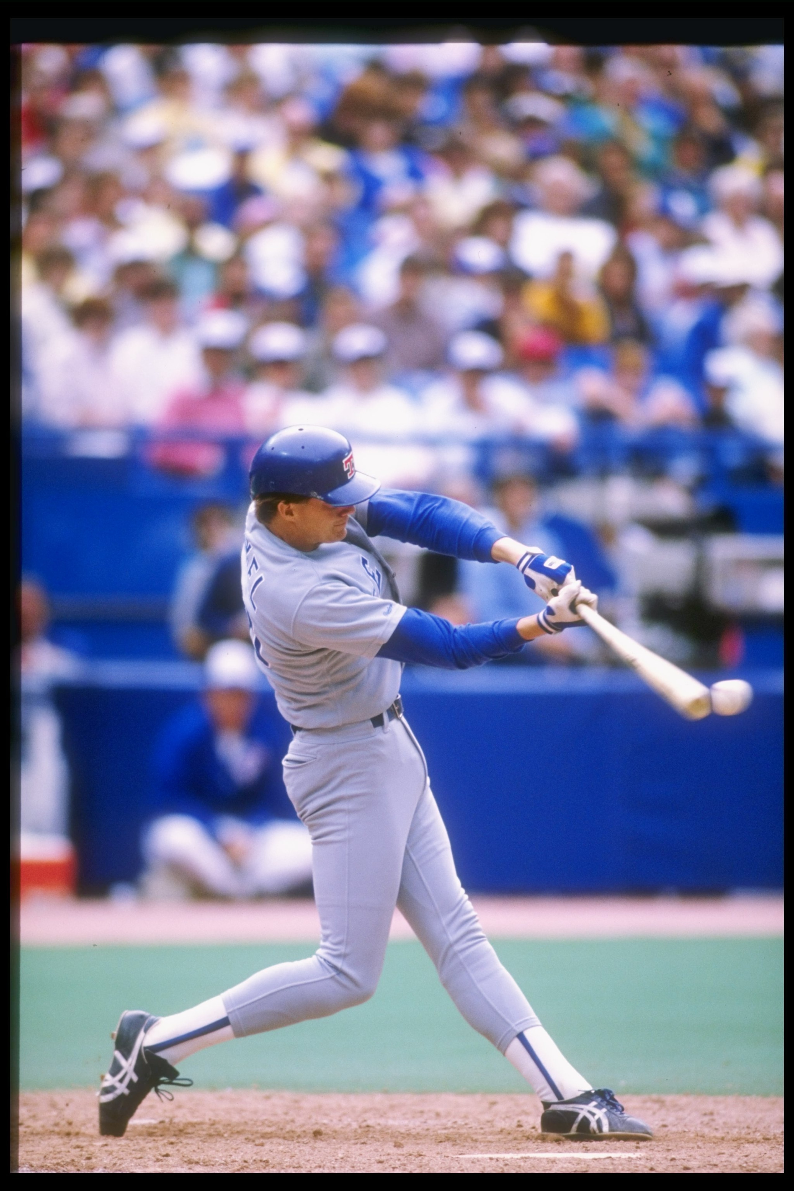 1989:  Jeff Kunkel of the Texas Rangers swings at the ball during a game against the Toronto Blue Jays at the Skydome in Toronto, Canada. Mandatory Credit: Rick Stewart  /Allsport