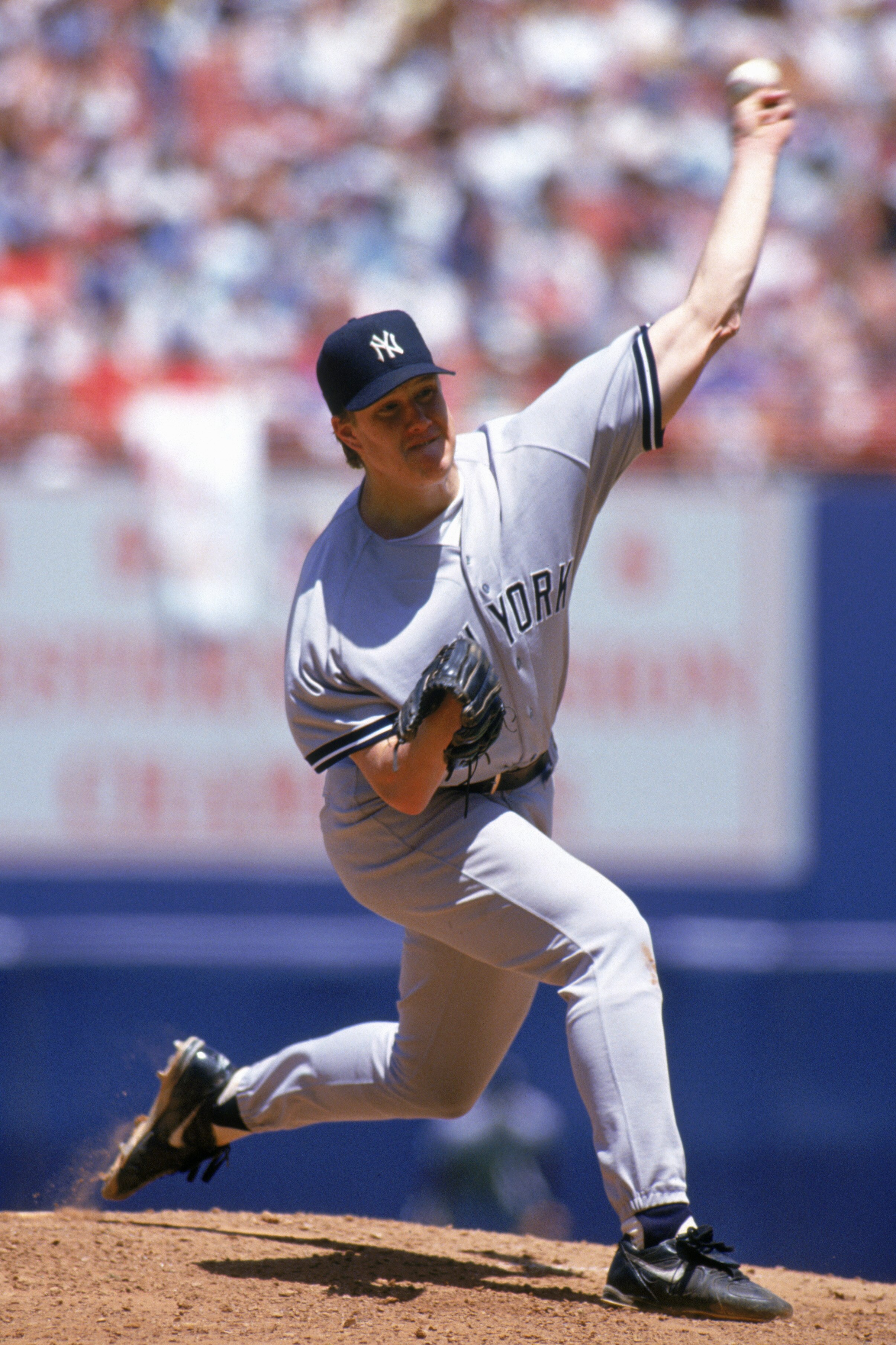 ANAHEIM, CA - JULY 11:  Jim Abbott #25 of the New York Yankees delivers a pitch during a game against the California Angels at Anaheim Stadium on July 11, 1993 in Anaheim, California.  (Photo by Jonathan Daniel/Getty Images)