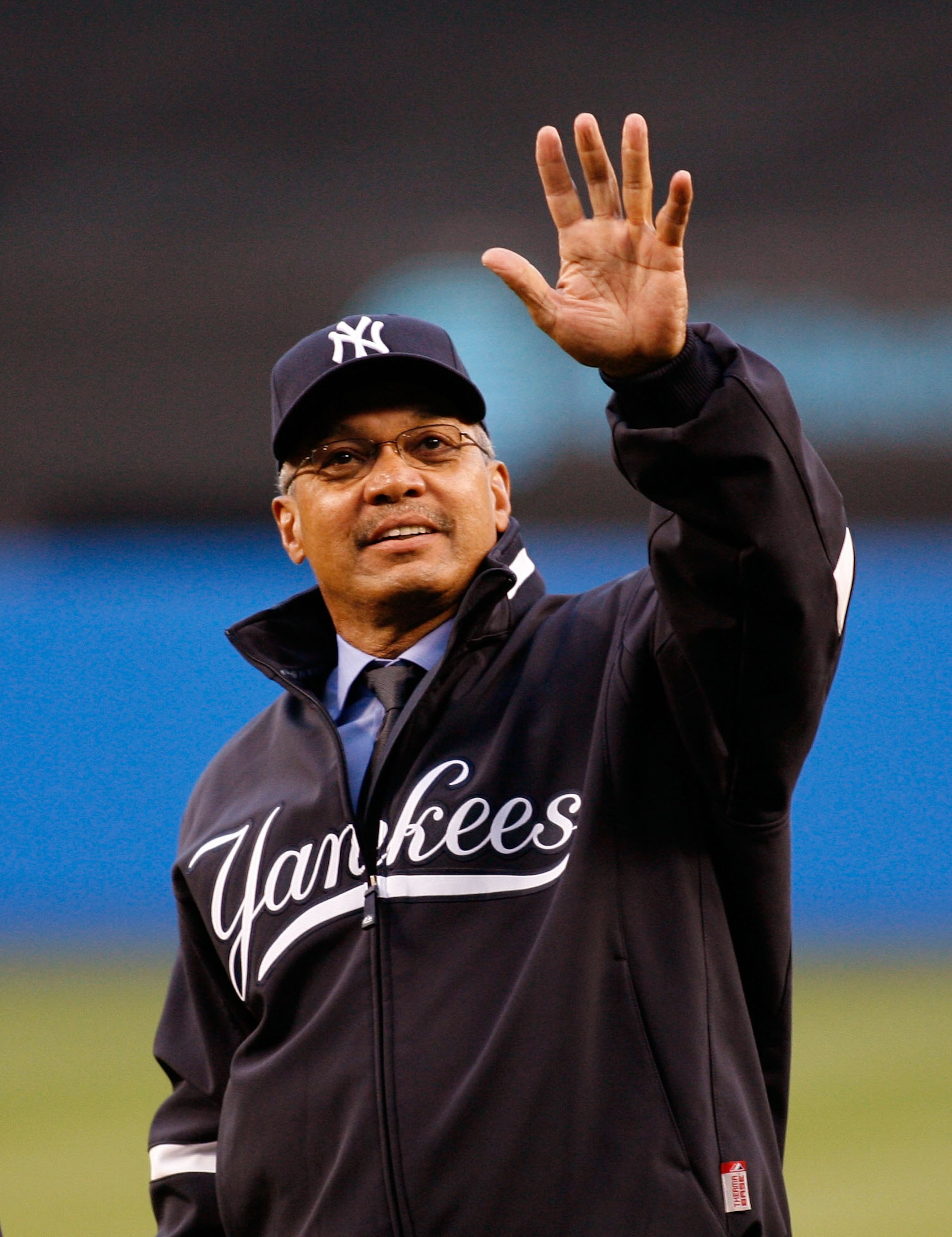 NEW YORK - APRIL 01:  Hall of famer Reggie Jackson  formerly of the New York Yankees waves to fans after throwing out the first pitch during Opening Day against the Toronto Blue Jays at Yankee Stadium April 1, 2008 in the Bronx borough of New York City.