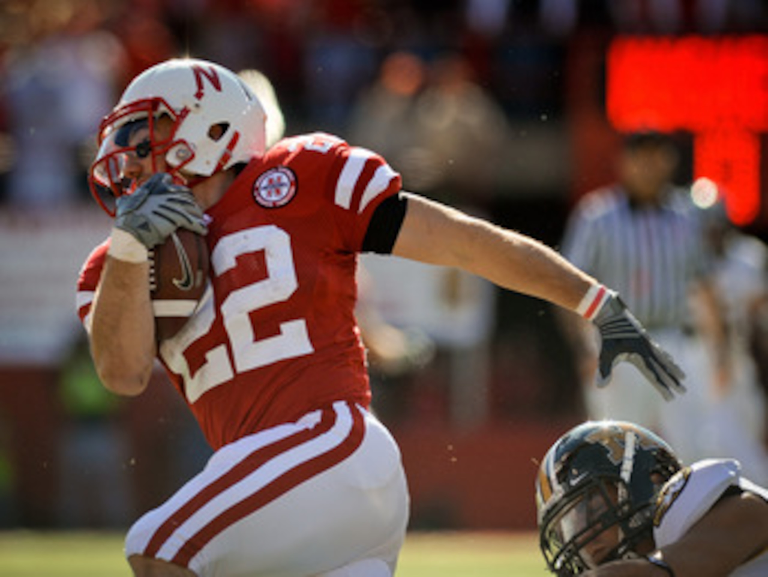 LINCOLN, NE - OCTOBER 30: Running back Rex Burkhead #22 of the Nebraska Cornhuskers runs during first half action of their game at Memorial Stadium on October 30, 2010 in Lincoln, Nebraska. Nebraska Defeated Missouri 31-17. (Photo by Eric Francis/Getty Im LINCOLN, NE - OCTOBER 30: Running back Rex Burkhead #22 of the Nebraska Cornhuskers runs during first half action of their game at Memorial Stadium on October 30, 2010 in Lincoln, Nebraska. Nebraska Defeated Missouri 31-17. (Photo by Eric Francis/Getty Im