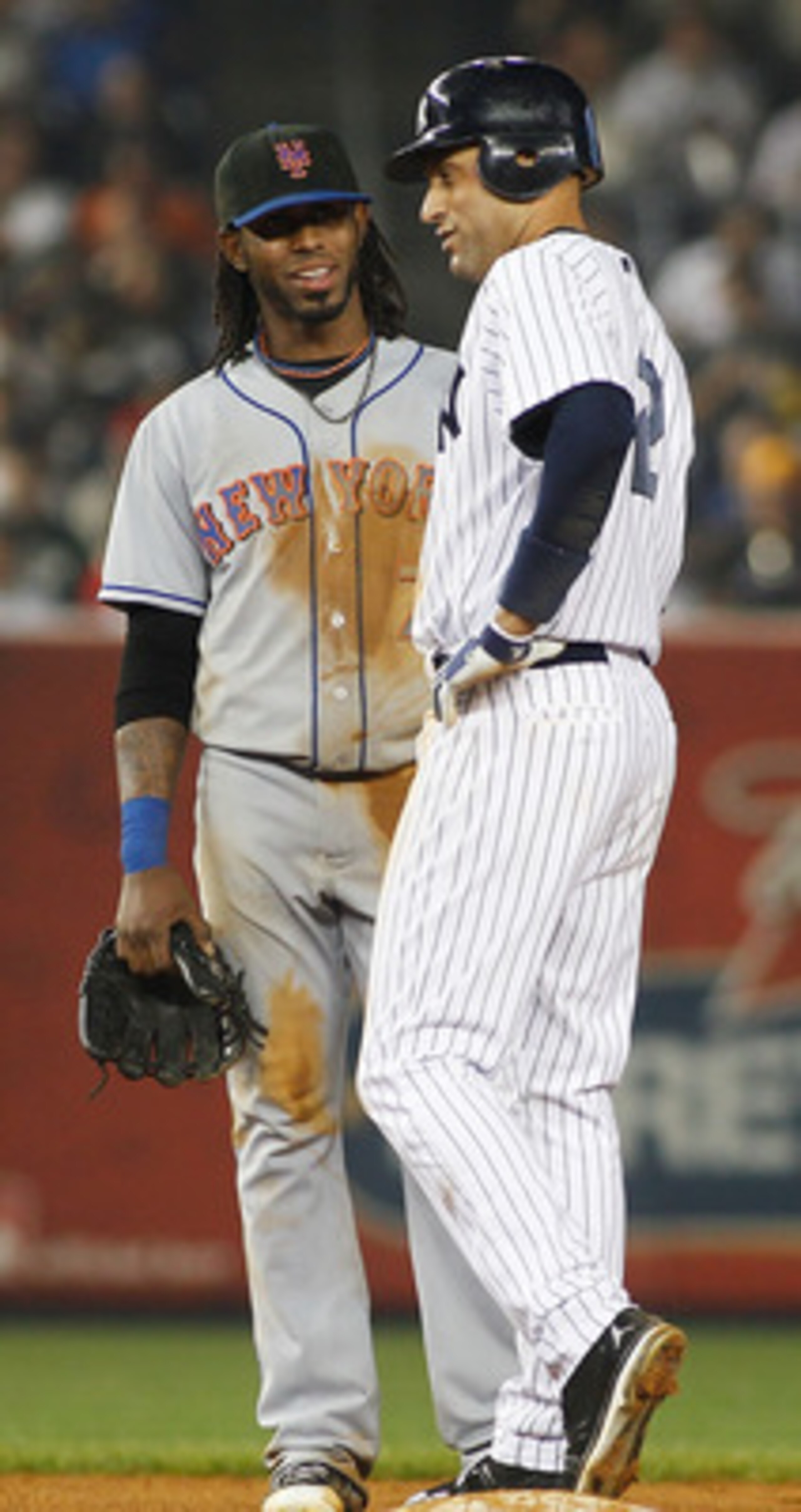 NEW YORK - MAY 21:  Derek Jeter #2 of the New York Yankees and Jose Reyes #7 of the New York Mets share a laugh on May 21, 2011 at Yankee Stadium in the Bronx borough of New York City. Yankees defeat the Mets 7-3.  (Photo by Mike Stobe/Getty Images)