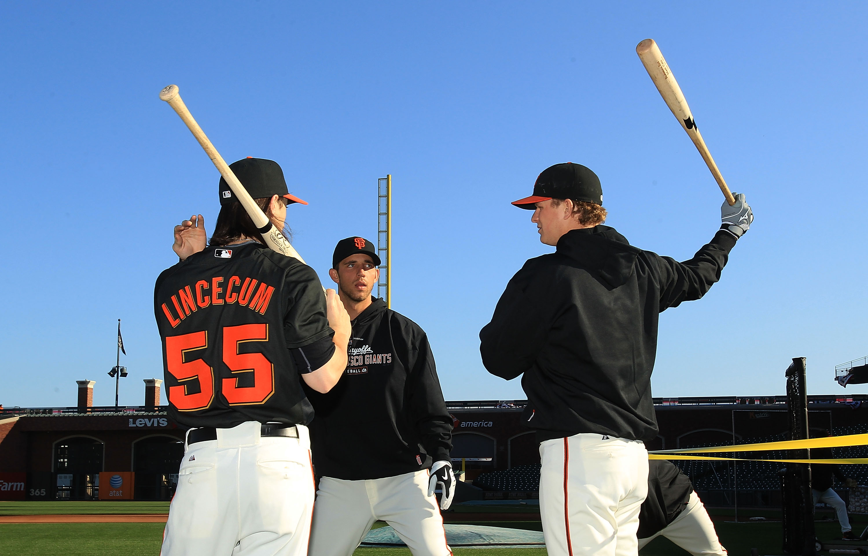 SAN FRANCISCO - OCTOBER 18:  Tim Lincecum #55 of the San Francisco Giants speaks to Matt Cain #18 and Madison Bumgarner #40 during a workout session for the NLCS at AT&T Park on October 18, 2010 in San Francisco, California.  (Photo by Ezra Shaw/Getty Ima
