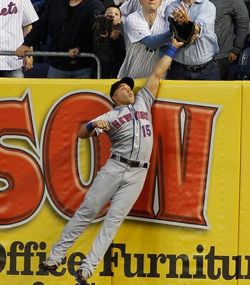 NEW YORK - MAY 20:  Mark Teixeira #25 of the New York Yankees (not pictured) hits a home run just over the leap of Carlos Beltran #15 of the New York Mets in the bottom of the third on May 20, 2011 at Yankee Stadium in the Bronx borough of New York City.