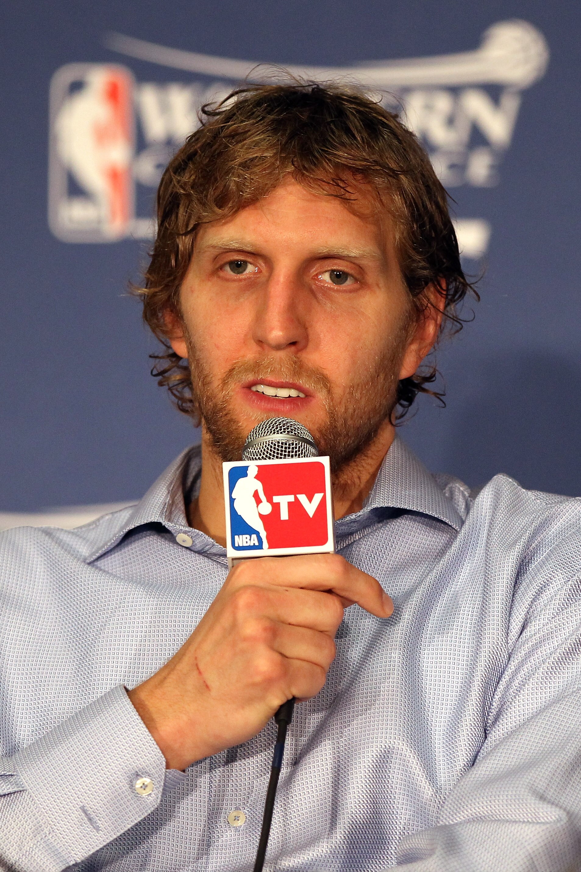 OKLAHOMA CITY, OK - MAY 23: Dirk Nowitzki #41 of the Dallas Mavericks answers questions after the Mavericks defeated the Oklahoma City Thunder 112-105 in overtime in Game Four of the Western Conference Finals during the 2011 NBA Playoffs at Oklahoma City OKLAHOMA CITY, OK - MAY 23: Dirk Nowitzki #41 of the Dallas Mavericks answers questions after the Mavericks defeated the Oklahoma City Thunder 112-105 in overtime in Game Four of the Western Conference Finals during the 2011 NBA Playoffs at Oklahoma City