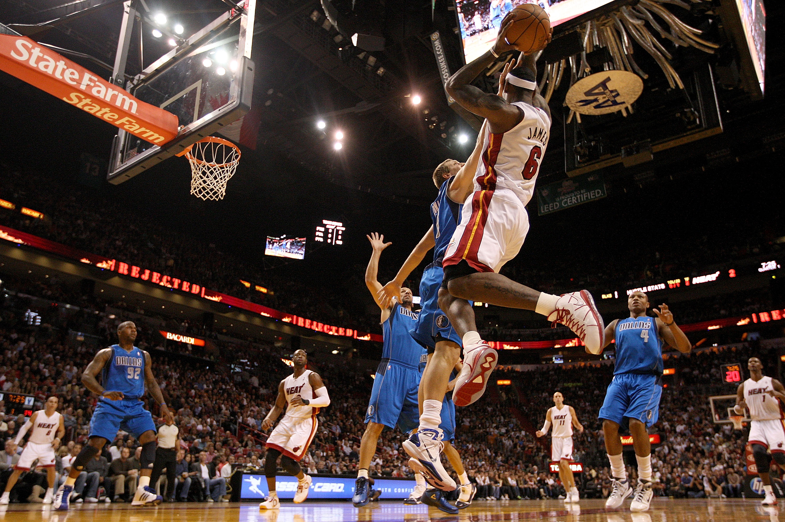 MIAMI, FL - DECEMBER 20: LeBron James #6 of the Miami Heat passes over Dirk Nowitzki #41 of the Dallas Mavericks during a game at American Airlines Arena on December 20, 2010 in Miami, Florida. NOTE TO USER: User expressly acknowledges and agrees that, MIAMI, FL - DECEMBER 20: LeBron James #6 of the Miami Heat passes over Dirk Nowitzki #41 of the Dallas Mavericks during a game at American Airlines Arena on December 20, 2010 in Miami, Florida. NOTE TO USER: User expressly acknowledges and agrees that,