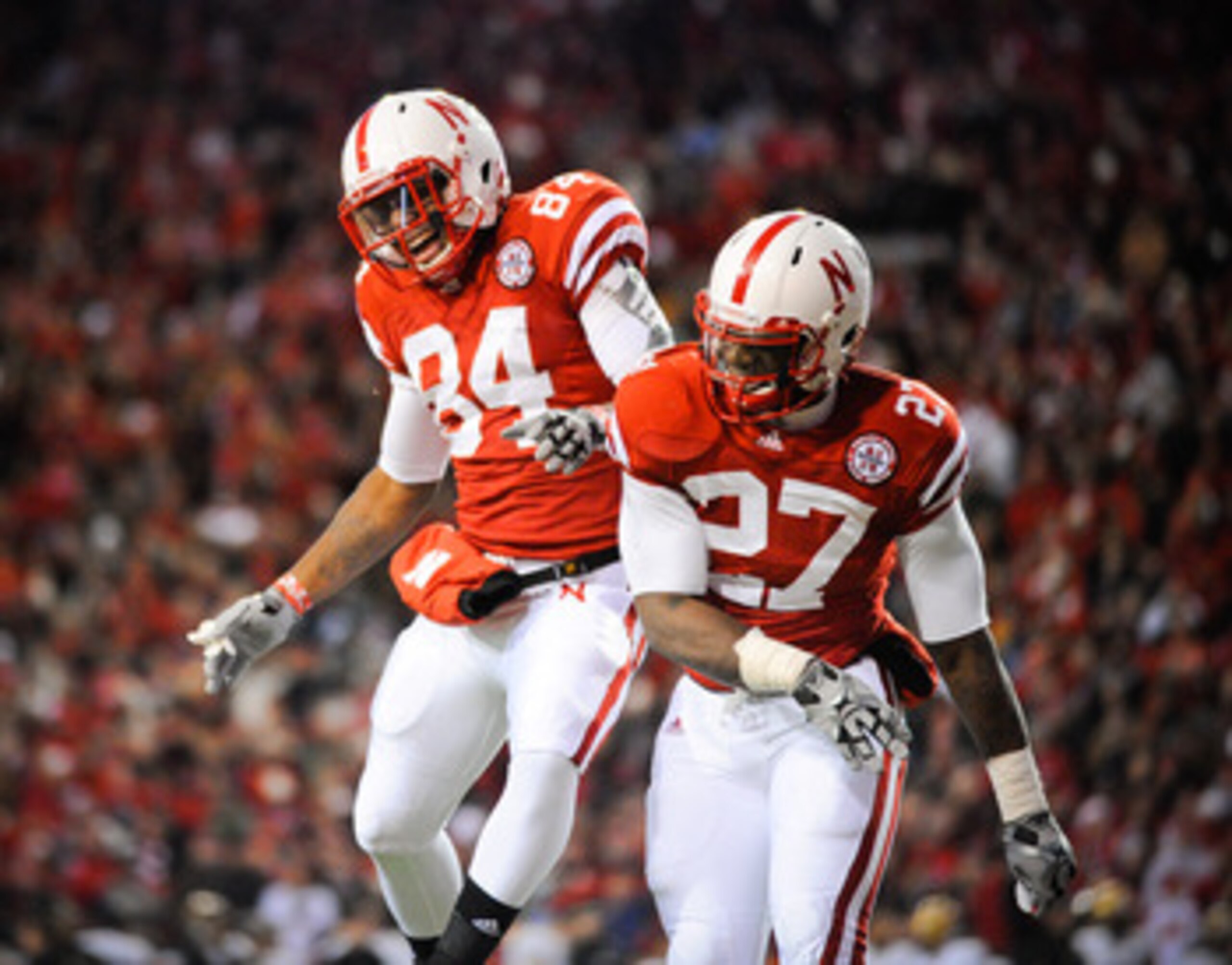 LINCOLN, NE - NOVEMBER 26: Dontrayevous Robinson #27 and Brandon Kinnie #84 of the Nebraska Cornhuskers celebrate a touchdown during their game against the Colorado Buffaloes at Memorial Stadium on November 26, 2010 in Lincoln, Nebraska. Nebraska defeated LINCOLN, NE - NOVEMBER 26: Dontrayevous Robinson #27 and Brandon Kinnie #84 of the Nebraska Cornhuskers celebrate a touchdown during their game against the Colorado Buffaloes at Memorial Stadium on November 26, 2010 in Lincoln, Nebraska. Nebraska defeated