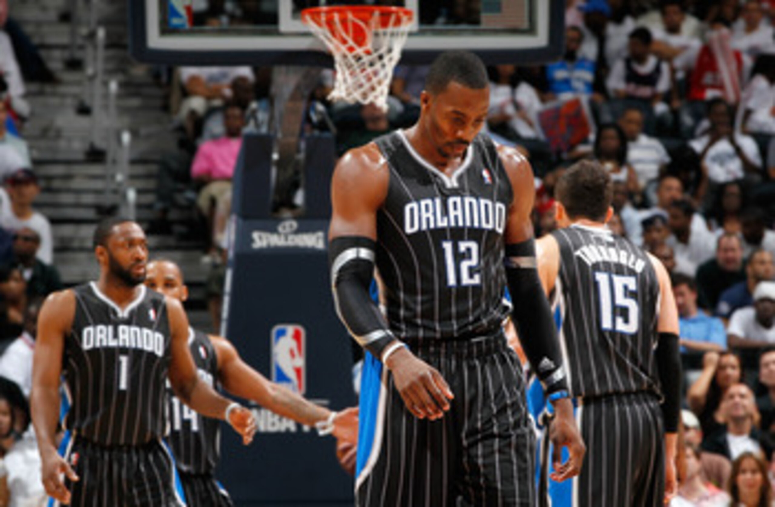 ATLANTA, GA - APRIL 24:  Dwight Howard #12 of the Orlando Magic walks downcourt after a turnover to the Atlanta Hawks during Game Four of the Eastern Conference Quarterfinals in the 2011 NBA Playoffs at Philips Arena on April 24, 2011 in Atlanta, Georgia.
