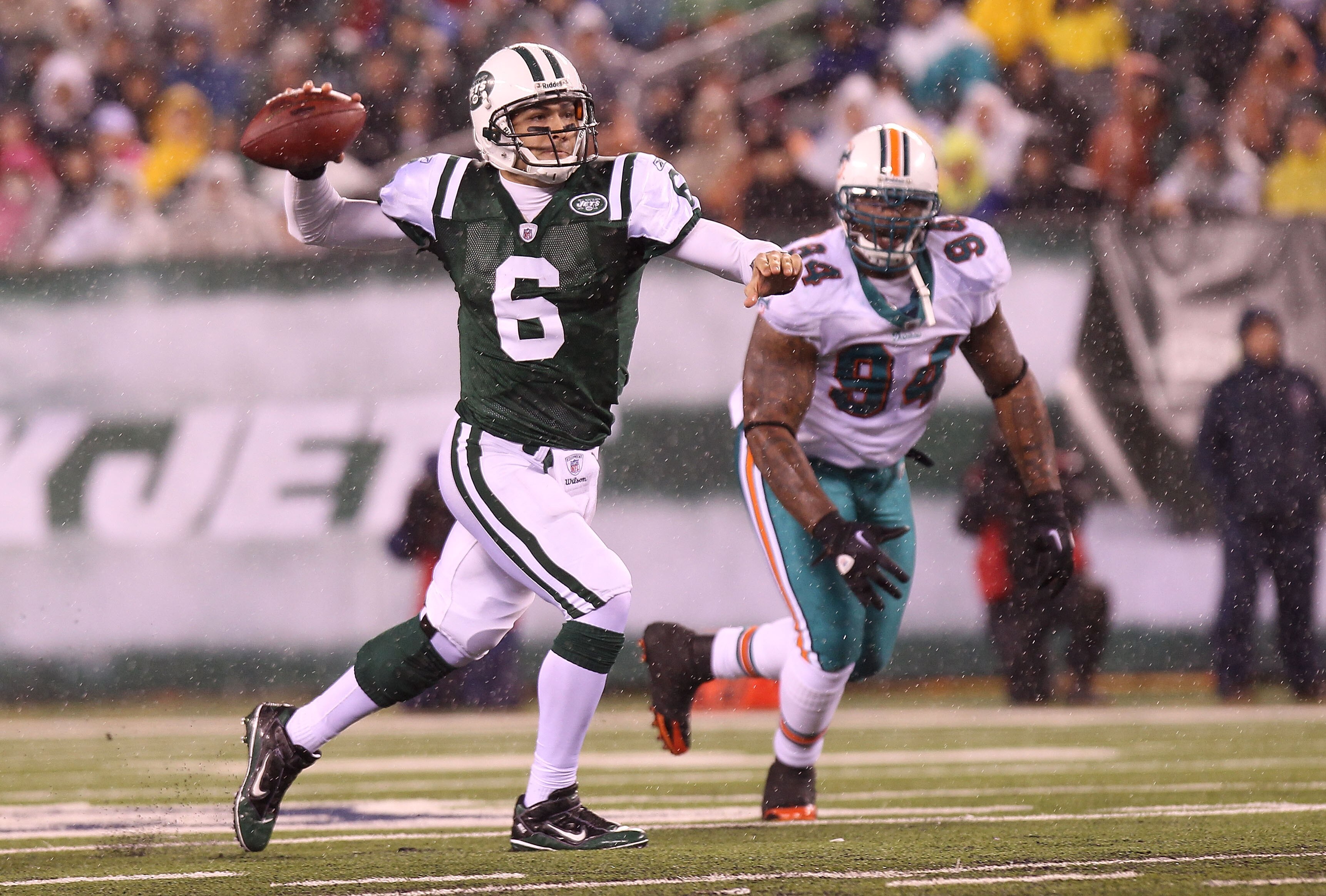 EAST RUTHERFORD, NJ - DECEMBER 12: Mark Sanchez #6 of the New York Jets opens up to pass against the Miami Dolphins at New Meadowlands Stadium on December 12, 2010 in East Rutherford, New Jersey.  (Photo by Nick Laham/Getty Images)