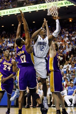 ORLANDO, FL - JUNE 09:  Dwight Howard #12 of the Orlando Magic goes up for a shot between Andrew Bynum #17 and Pau Gasol #16 of the Los Angeles Lakers in the second quarter of Game Three of the 2009 NBA Finals on June 9, 2009 at Amway Arena in Orlando, Fl