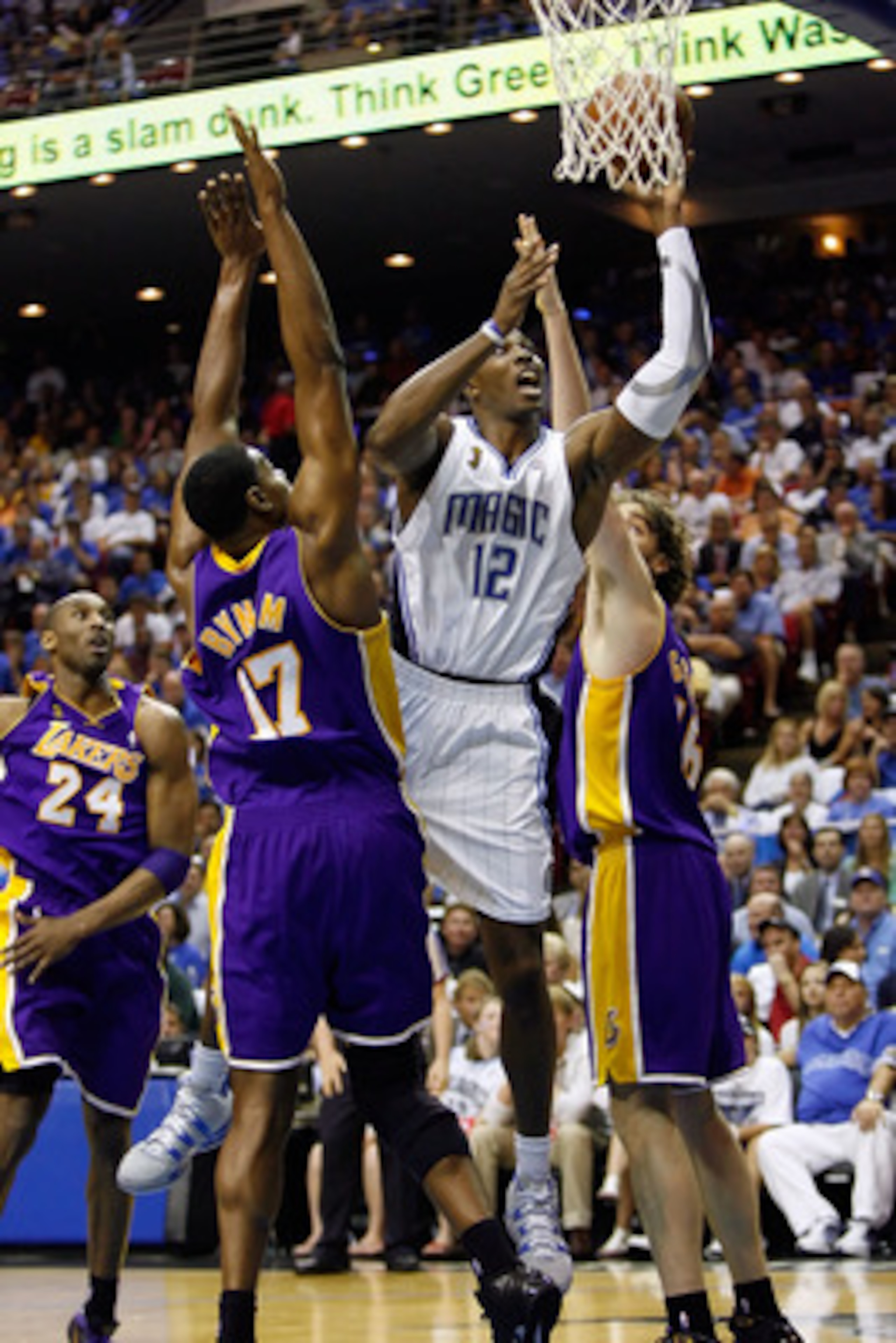 ORLANDO, FL - JUNE 09:  Dwight Howard #12 of the Orlando Magic goes up for a shot between Andrew Bynum #17 and Pau Gasol #16 of the Los Angeles Lakers in the second quarter of Game Three of the 2009 NBA Finals on June 9, 2009 at Amway Arena in Orlando, Fl
