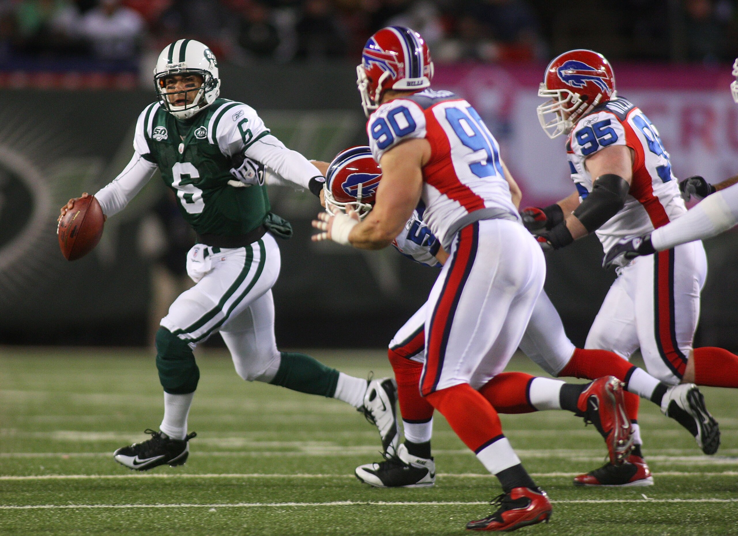 EAST RUTHERFORD, NJ - OCTOBER 18:  Ouaterback Mark Sanchez #6 of the New York Jets scrambles out of the pocket against the Buffalo Bills at Giants Stadium in the Meadowlands on October 18, 2009 in East Rutherford, New Jersey. The Bills defeated the Jets 1