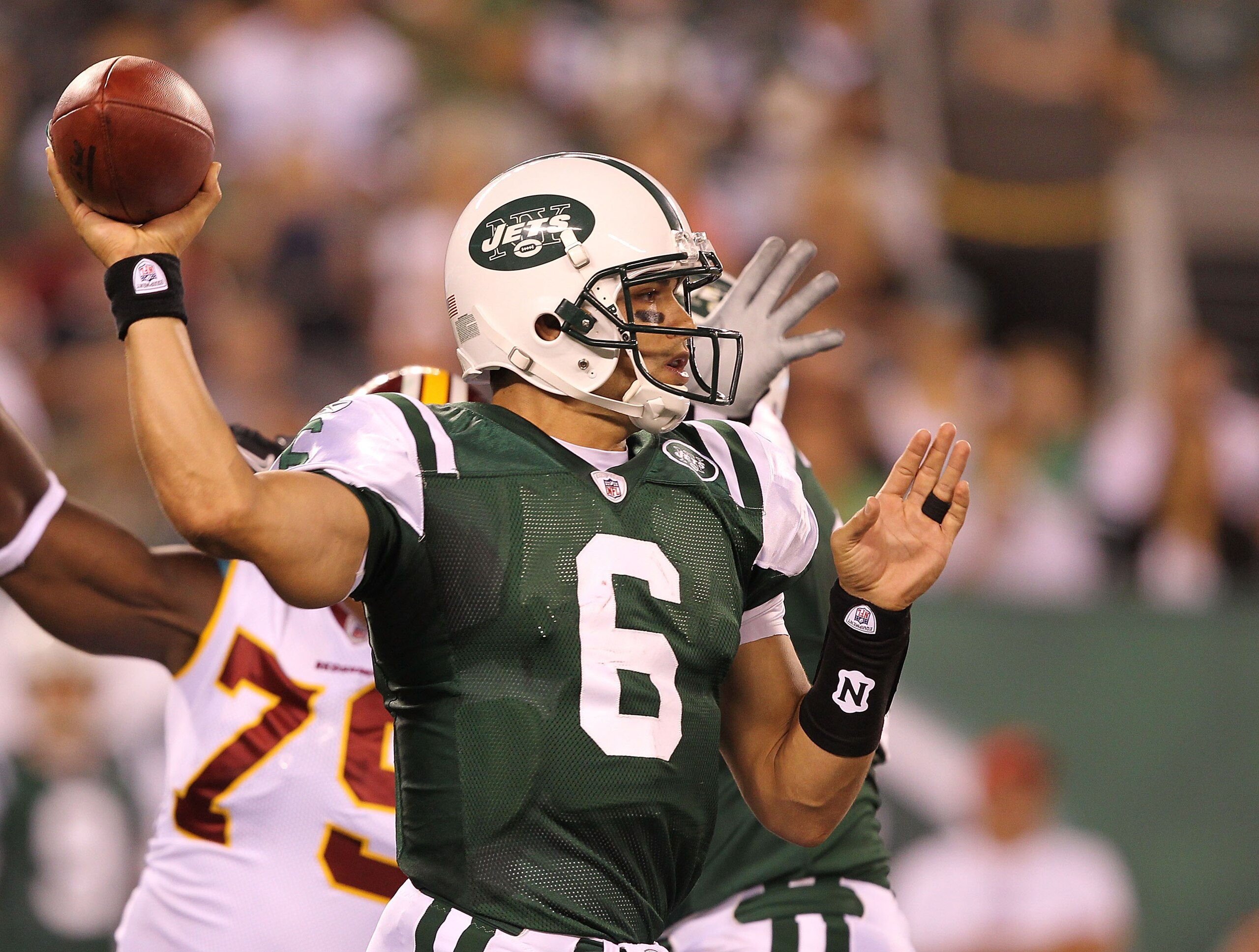 EAST RUTHERFORD, NJ - AUGUST 27:  Mark Sanchez #6 of the New York Jets in action against the Washington Redskins  during their preseason game on August 27, 2010 at the New Meadowlands Stadium  in East Rutherford, New Jersey.  (Photo by Al Bello/Getty Imag