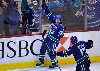 VANCOUVER, CANADA - MAY 18:  Kevin Bieksa #3 of the Vancouver Canucks celebrates his second period goal againstt the San Jose Sharks in Game Two of the Western Conference Finals during the 2011 Stanley Cup Playoffs at Rogers Arena on May 18, 2011 in Vanco