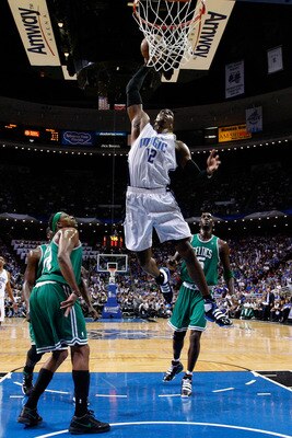 ORLANDO, FL - MAY 26:  Dwight Howard #12 of the Orlando Magic dunks against Paul Pierce #34 and Kevin Garnett #5 of the Boston Celtics in Game Five of the Eastern Conference Finals during the 2010 NBA Playoffs at Amway Arena on May 26, 2010 in Orlando, Fl